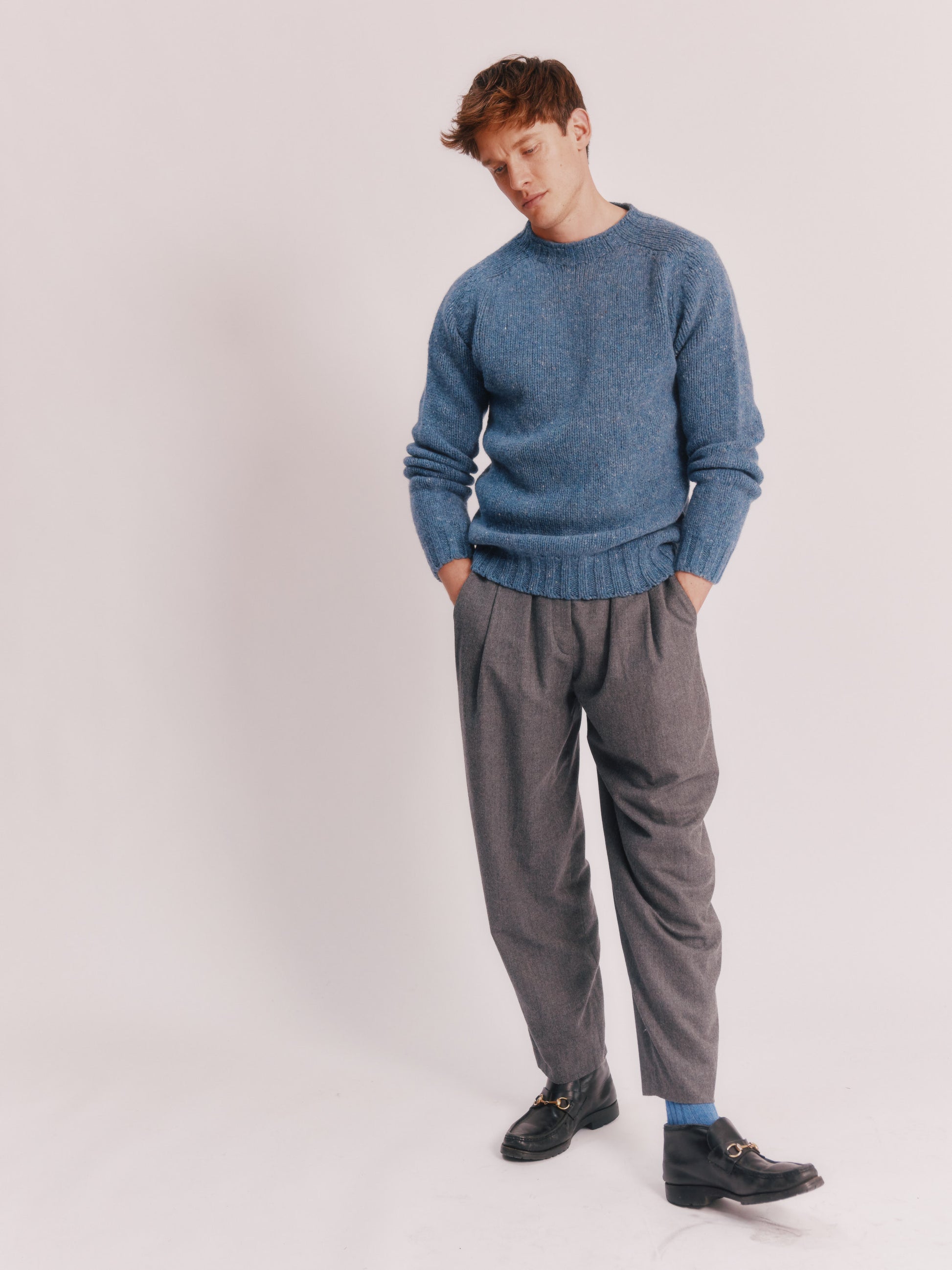 Model wearing a Bosie Knitwear Blue Mogganer Trawlerman Chunky Glenugie Nep Sweater in colour Ossian Blue.