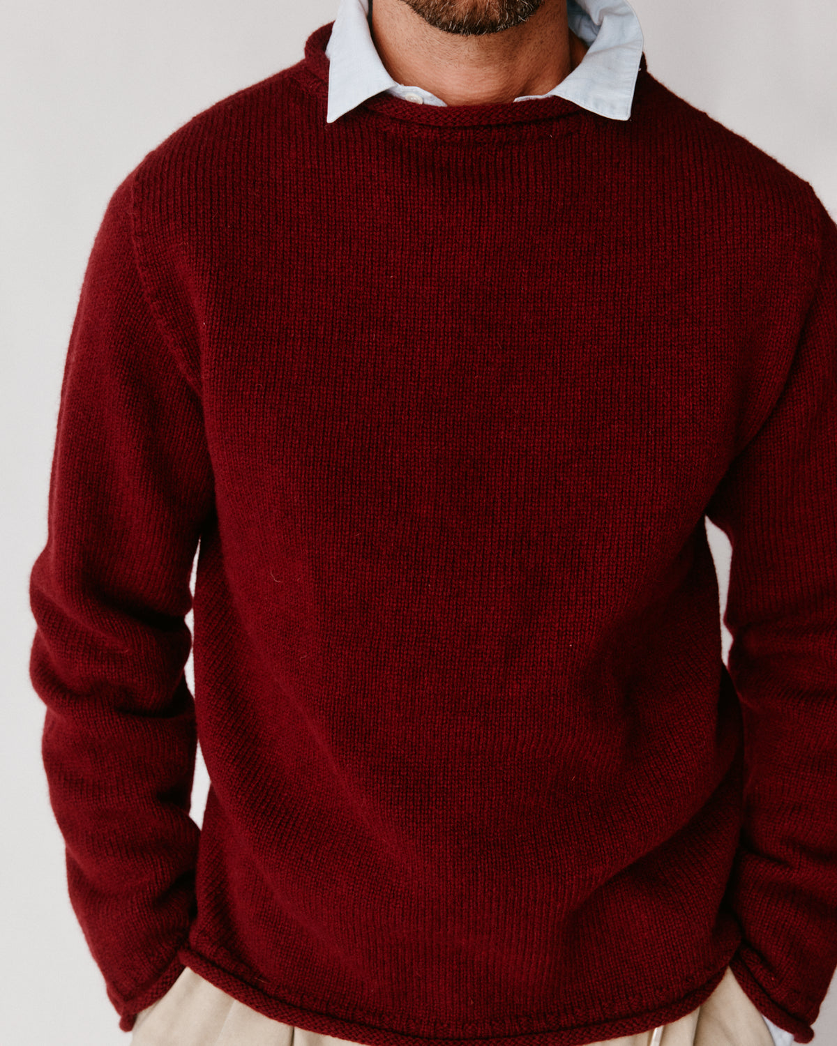 A model wearing a Bosie Blue Mogganer Whaler Rolled Neck Chunky Sweater in colour[ Claret / Bordeaux Mix.