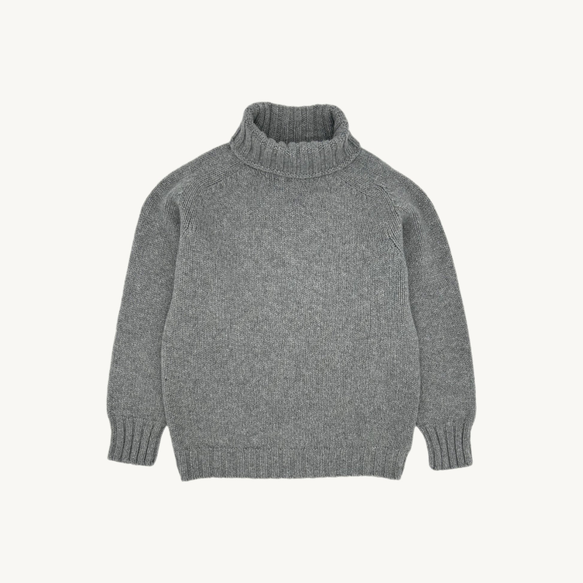 Flatbed photograph of a Bosie Knitwear Blue Mogganer Womens Siren Merino Polo Neck Sweater in colour Flannel Grey.