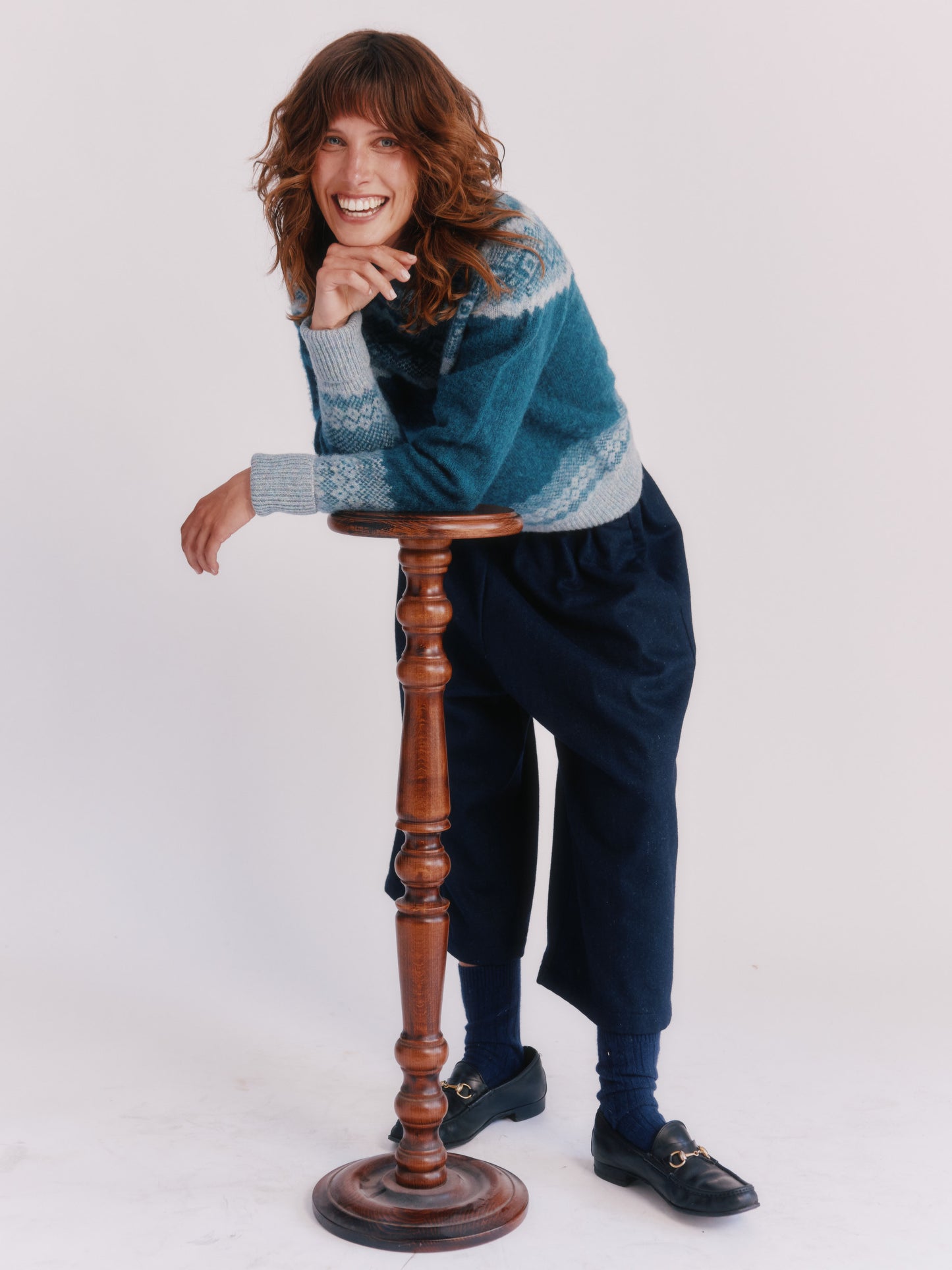 Model wearing Borealis Yoke Brushed Fair Isle Women's Lambswool Sweater in colour Storm Dark Teal.