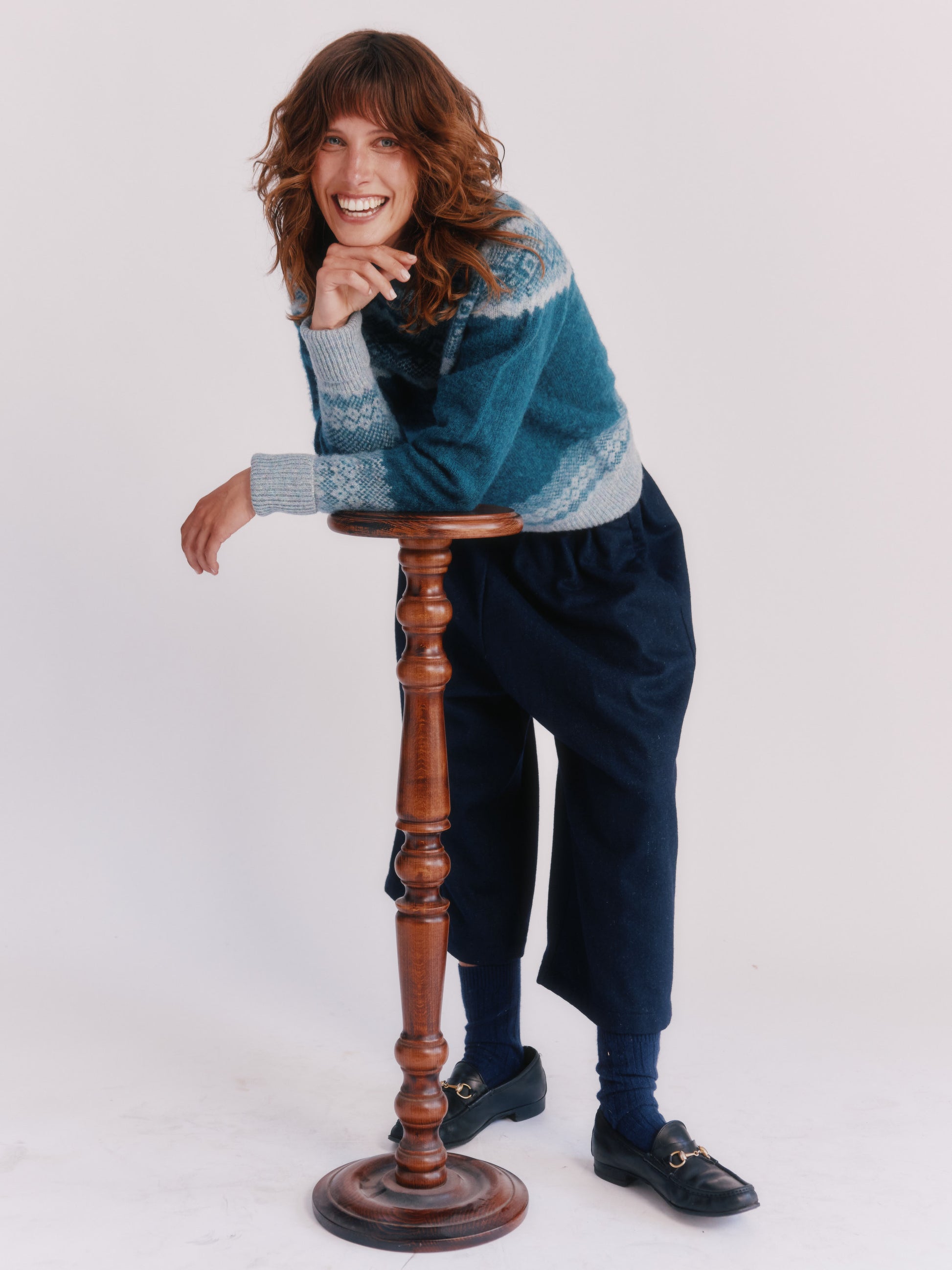 Model wearing Borealis Yoke Brushed Fair Isle Women's Lambswool Sweater in colour Storm Dark Teal.