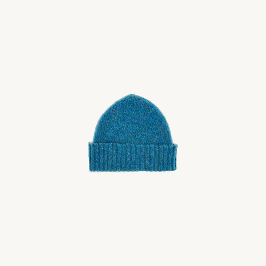 Flatbed photograph of Bosie Brushed Shetland Wool Beanie Hat in colour Azure Blue.