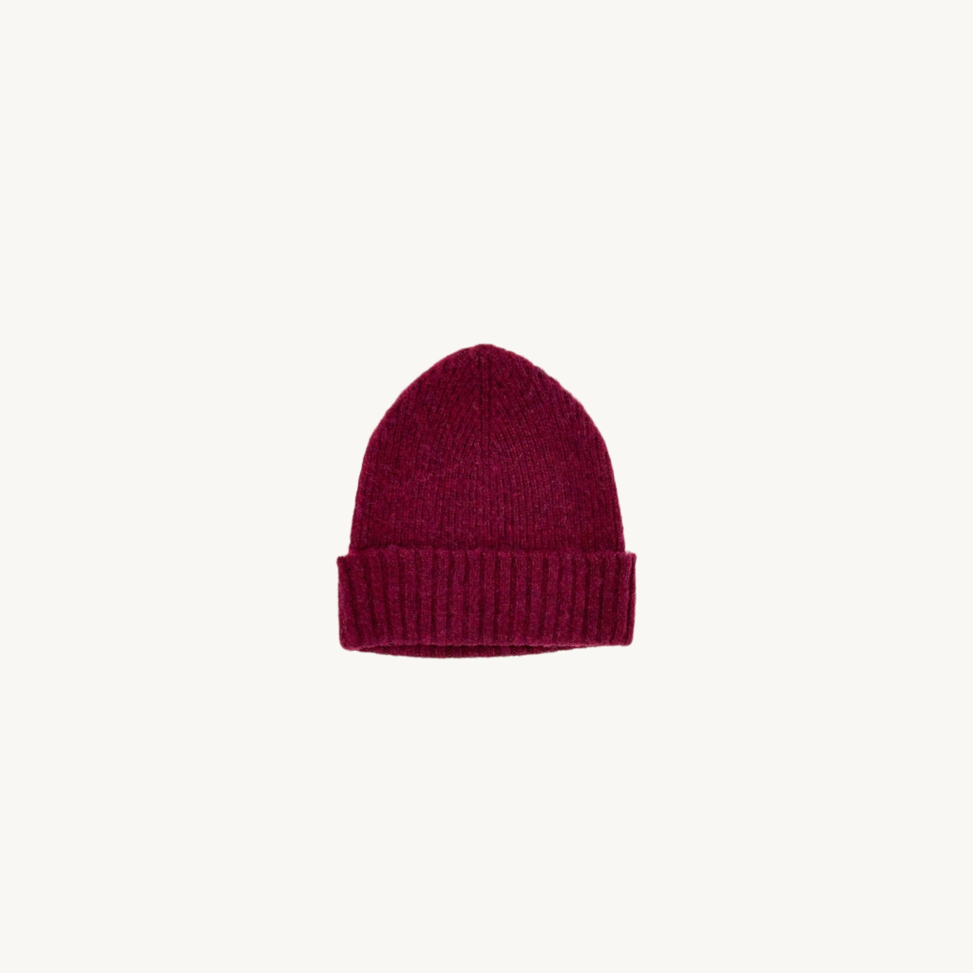 Flatbed photograph of a Bosie Brushed Shetland Wool Beanie Hat in colour Claret / Bordeaux MIx.
