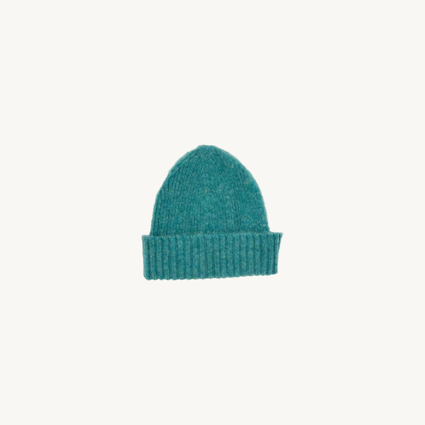 Flat bed photograph of Bosie Brushed Shetland Wool Beanie Hat in the colour Marble Gemstone Blue