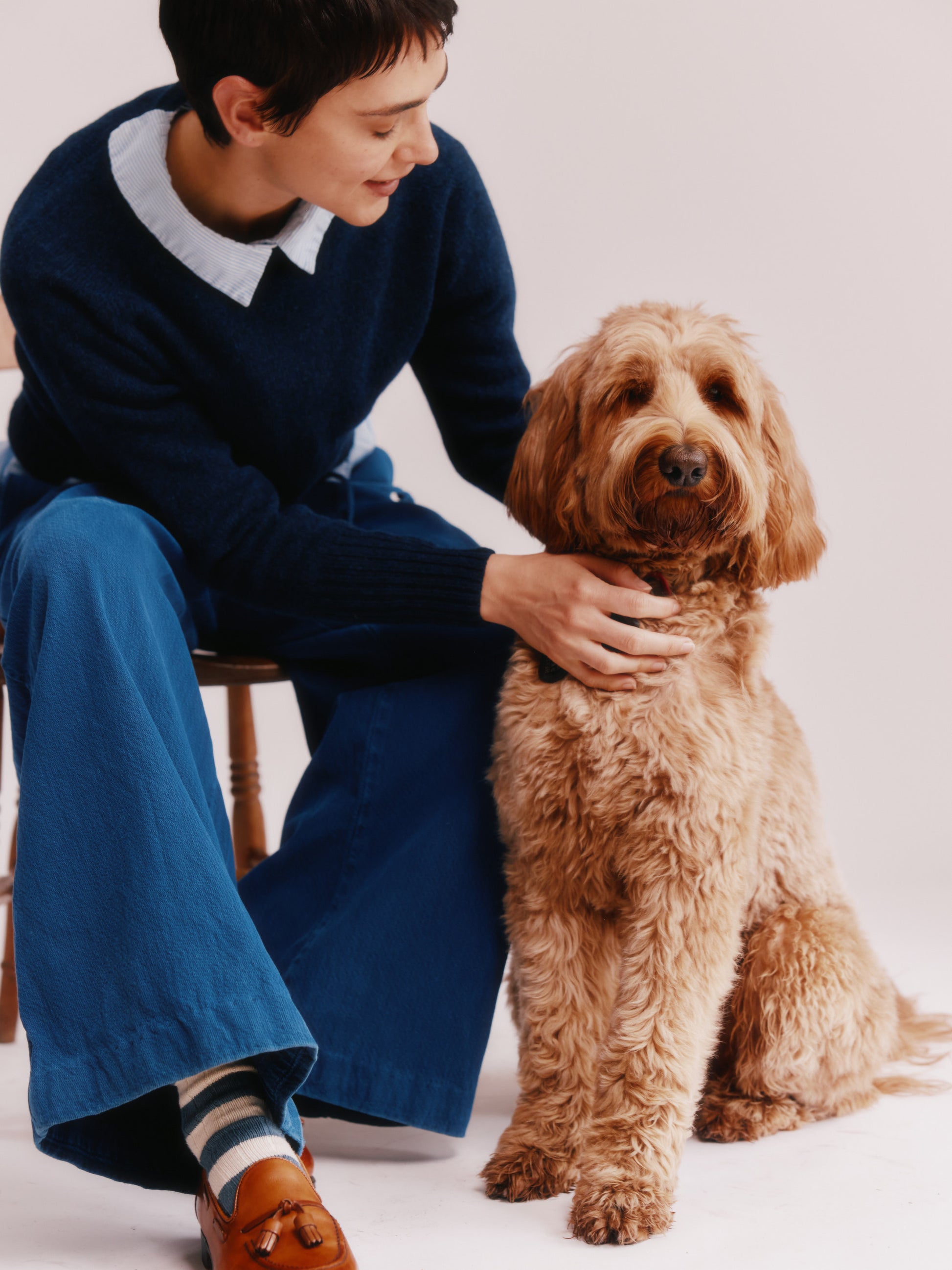 Model wearing a Bosie Knitwear  Geelong 2ply Crew Neck Womens Jumper in colour Cosmos Navy.