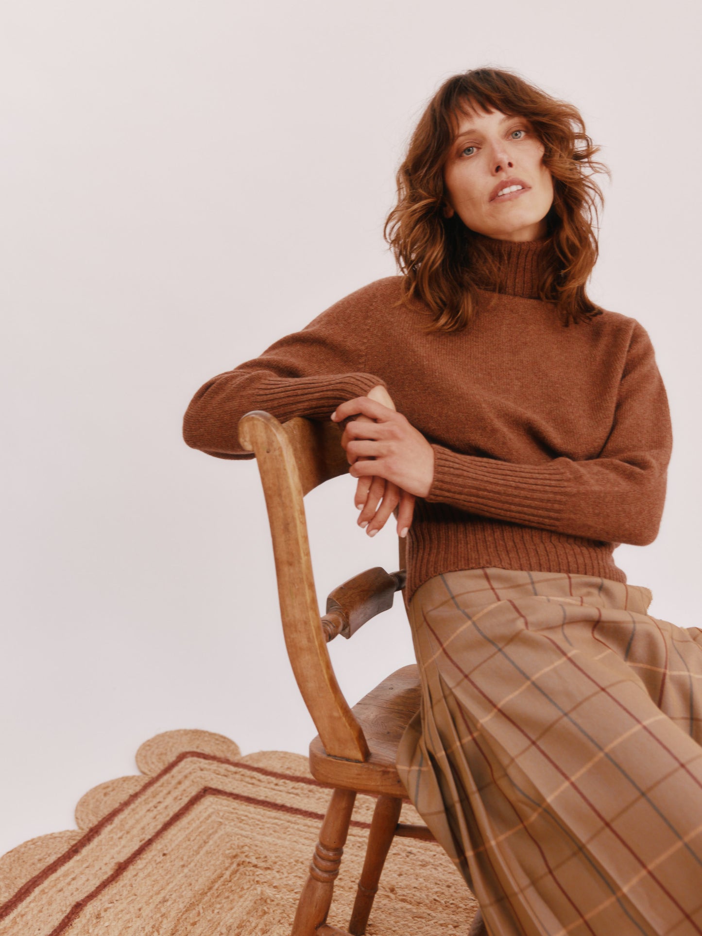 Model wearing a Bosie Knitwear Geelong Polo Neck Womens Jumper in colour Hazelnut Brown.