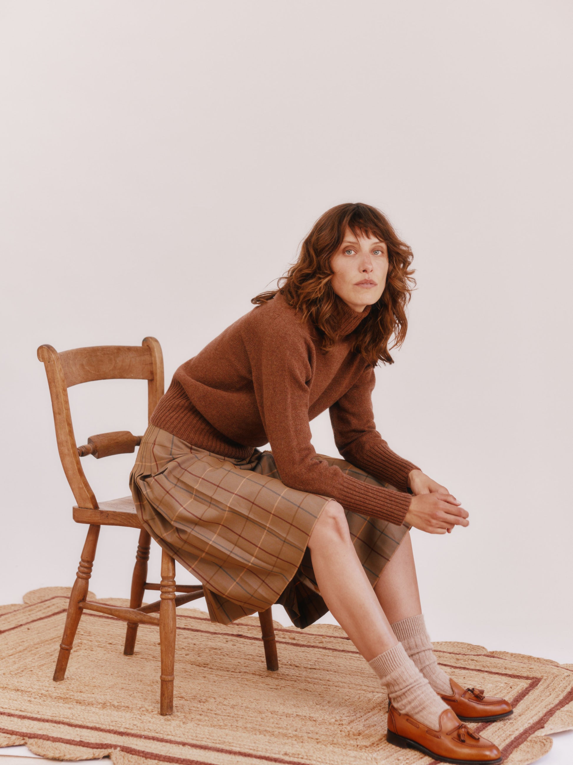 Model wearing a Bosie Knitwear Geelong Polo Neck Womens Jumper in colour Hazelnut Brown.