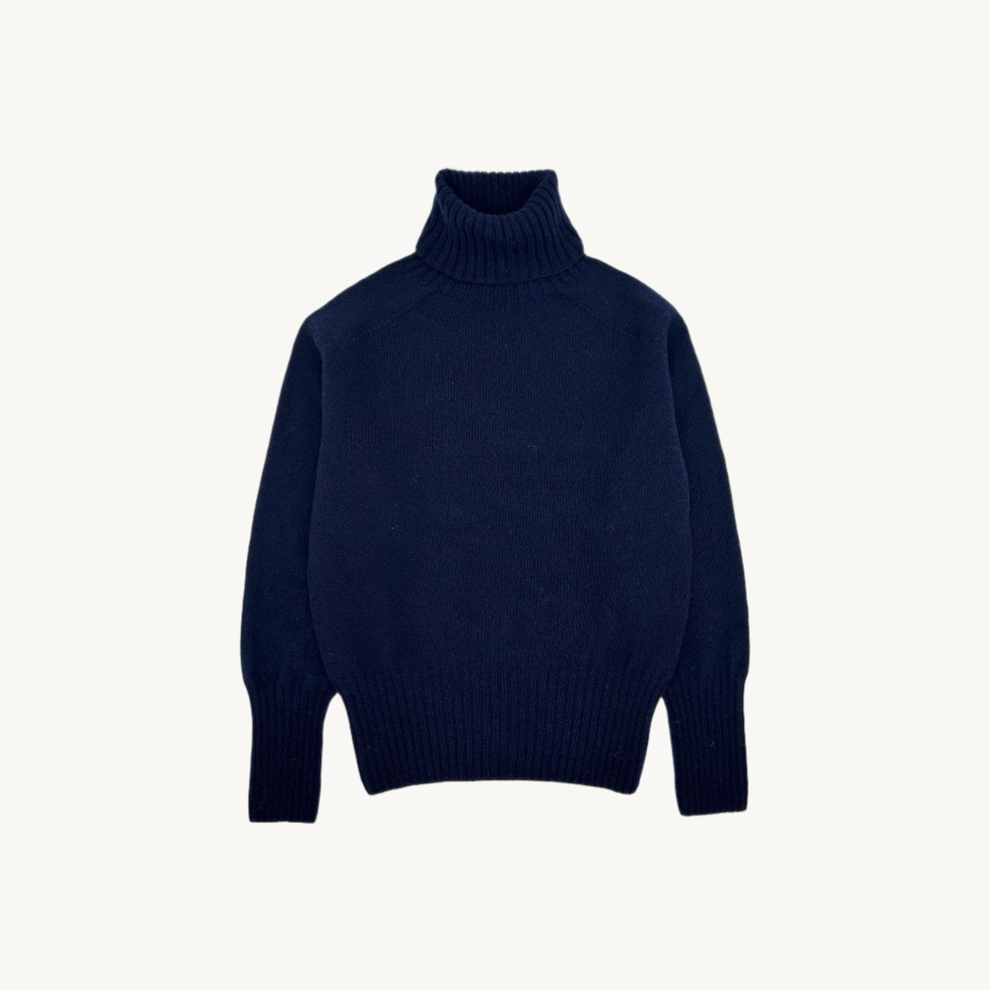 Flatbed photograph of a Bosie Geelong Polo Neck Womens Jumper in colour Navy.