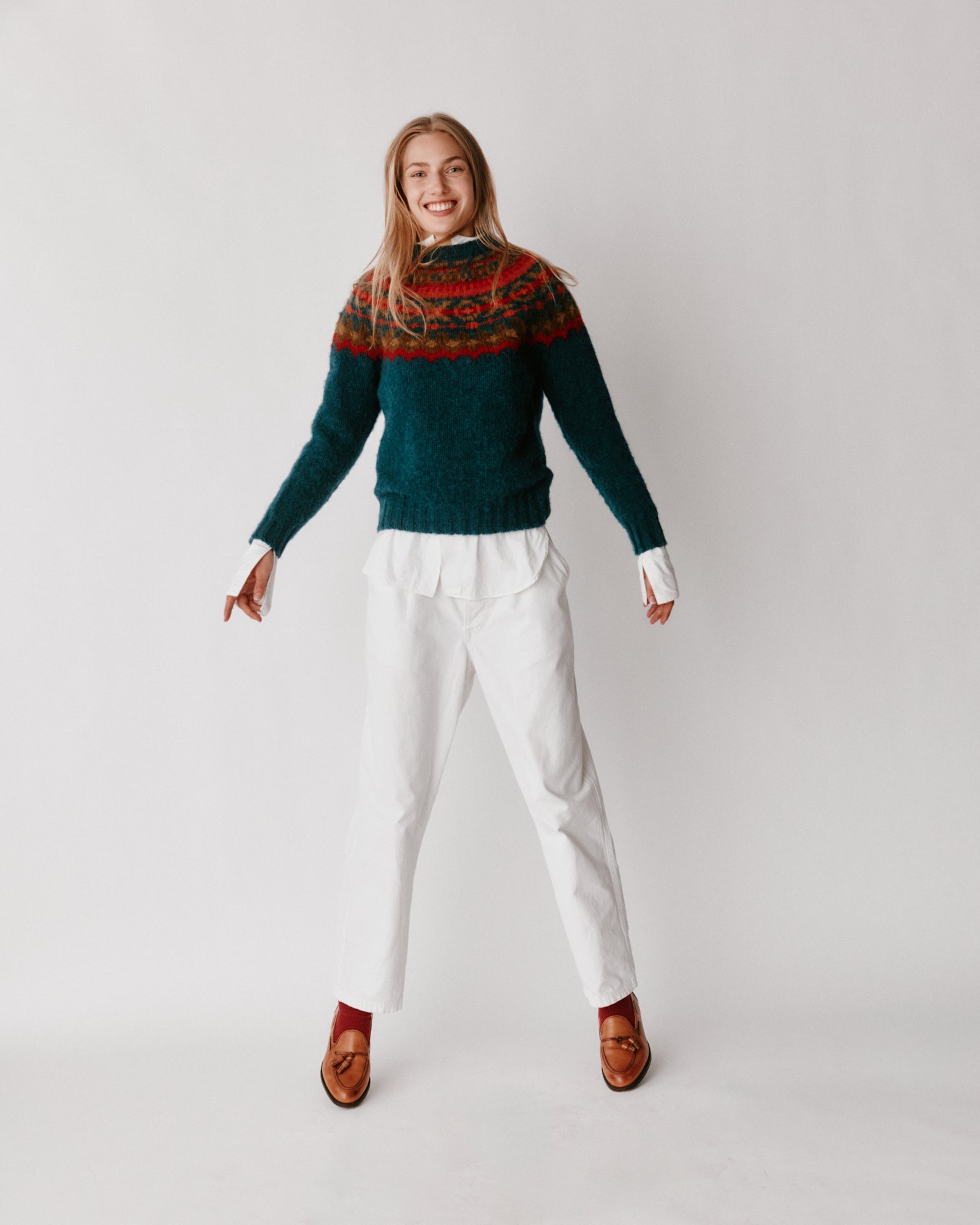A model wearing a Bosie Braemar Yoke Brushed Fair Isle Women's Lambswool Sweater in colour Tempest.
