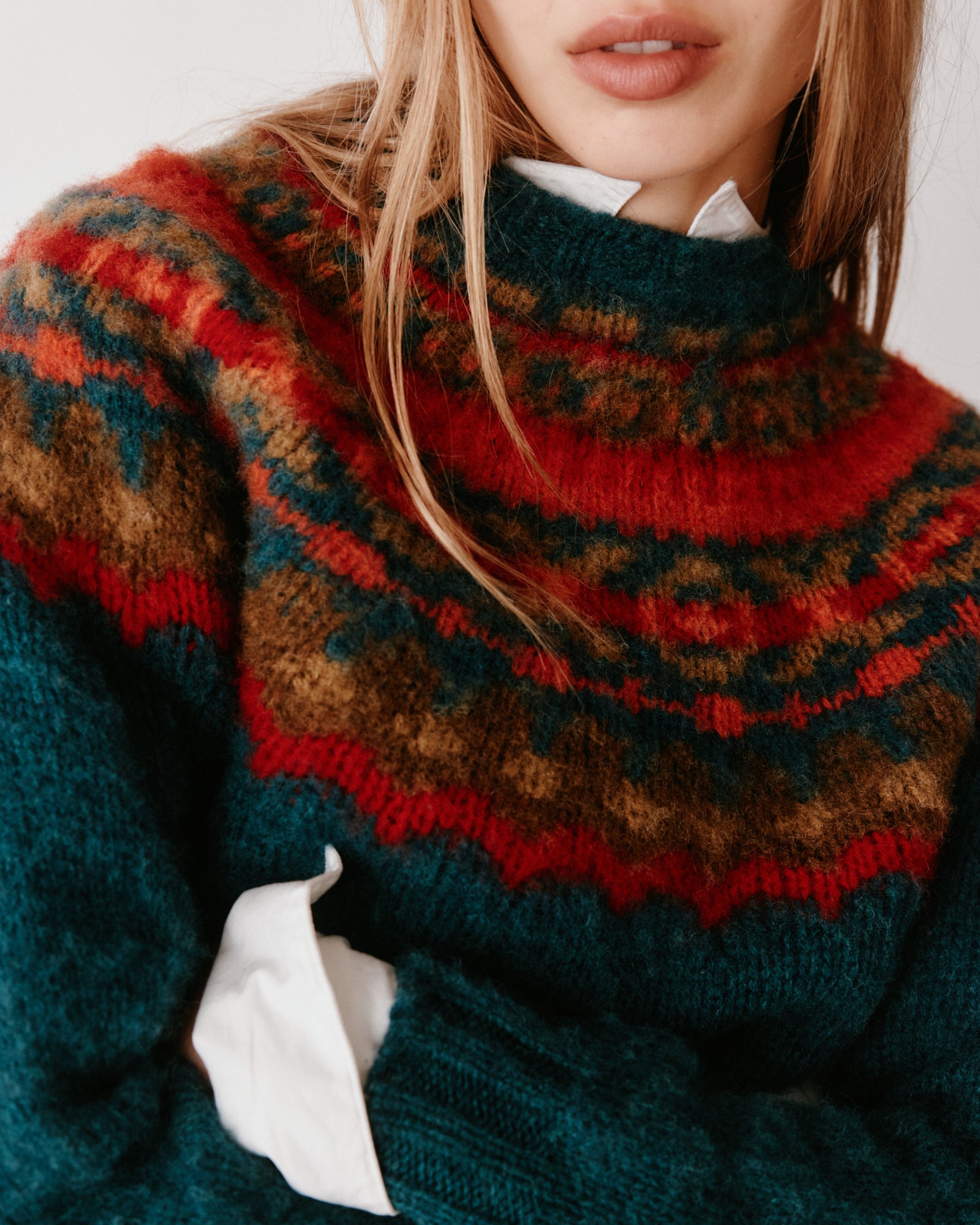 A model wearing a Bosie Braemar Yoke Brushed Fair Isle Women's Lambswool Sweater in colour Tempest.