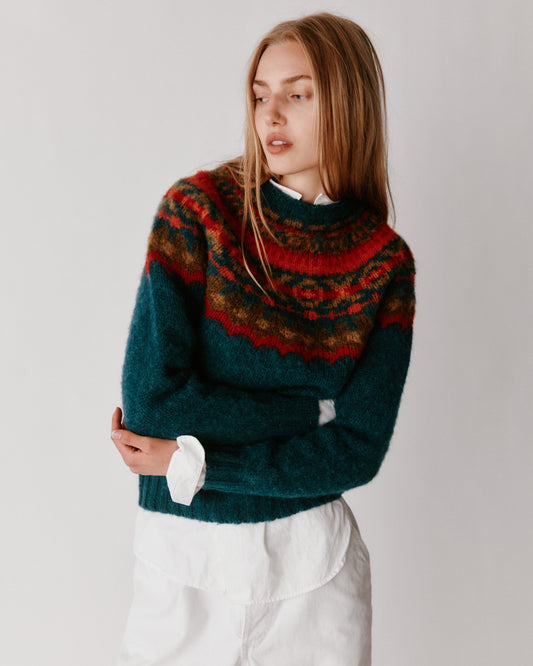 A model wearing a Bosie Braemar Yoke Brushed Fair Isle Women's Lambswool Sweater in colour Tempest.