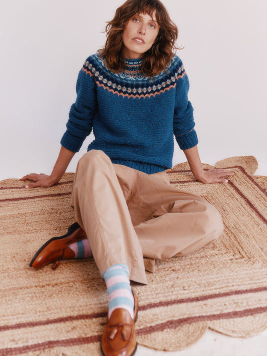 Model wearing a Bosie Knitwear Cottage Fair Isle Glenugie Nep Women's Sweater in colour Soay Blue.