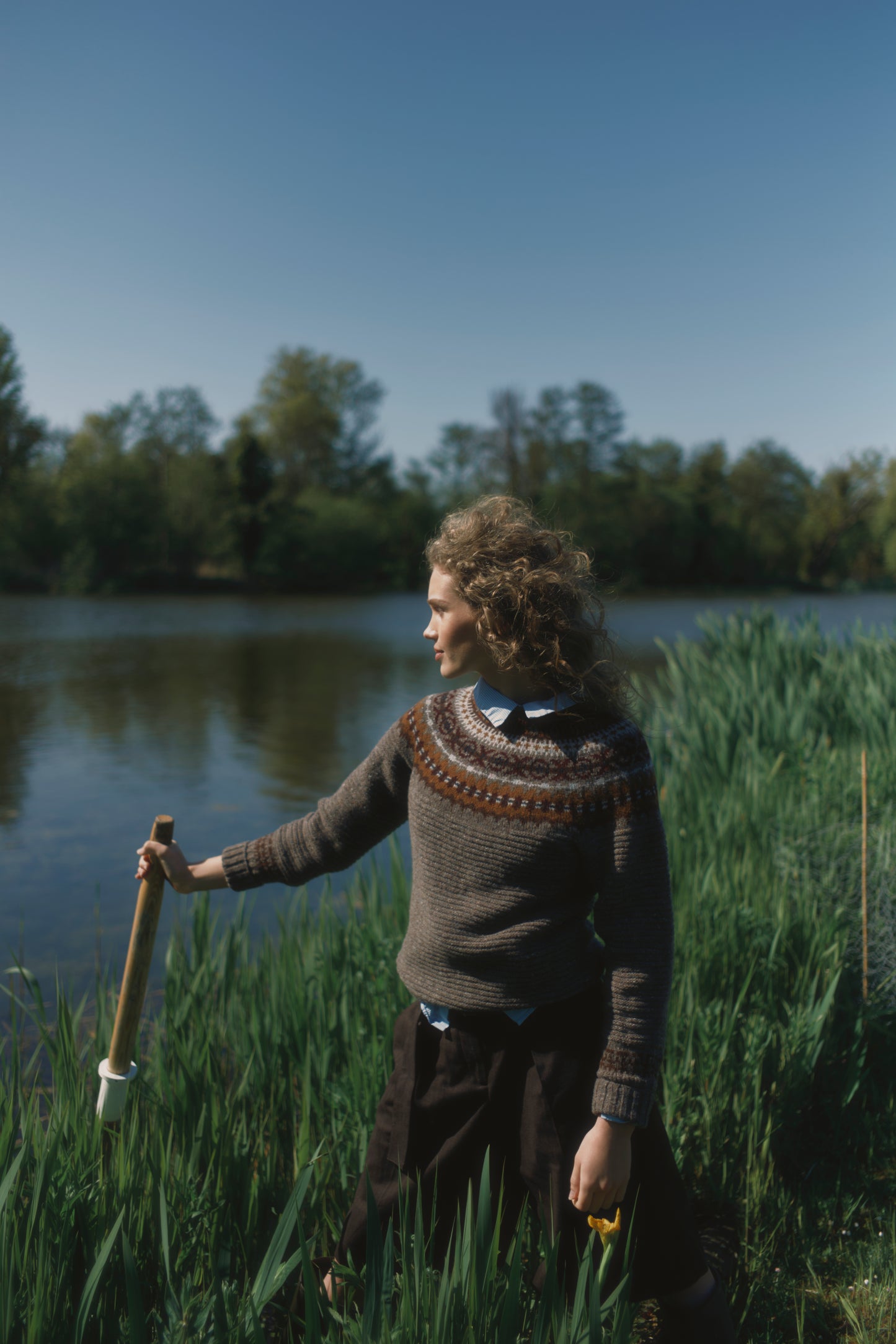 Model wearing a Bosie Knitwear Cottage Fair Isle Glenugie Nep Women's Sweater in colour Torridon Grey.