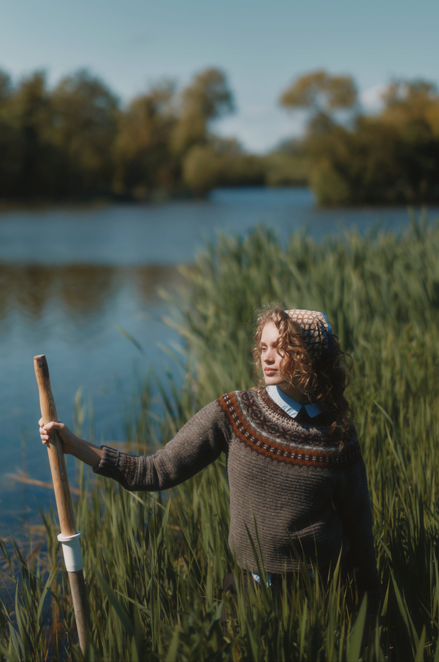 Model wearing a Bosie Knitwear Cottage Fair Isle Glenugie Nep Women's Sweater in colour Torridon Grey.