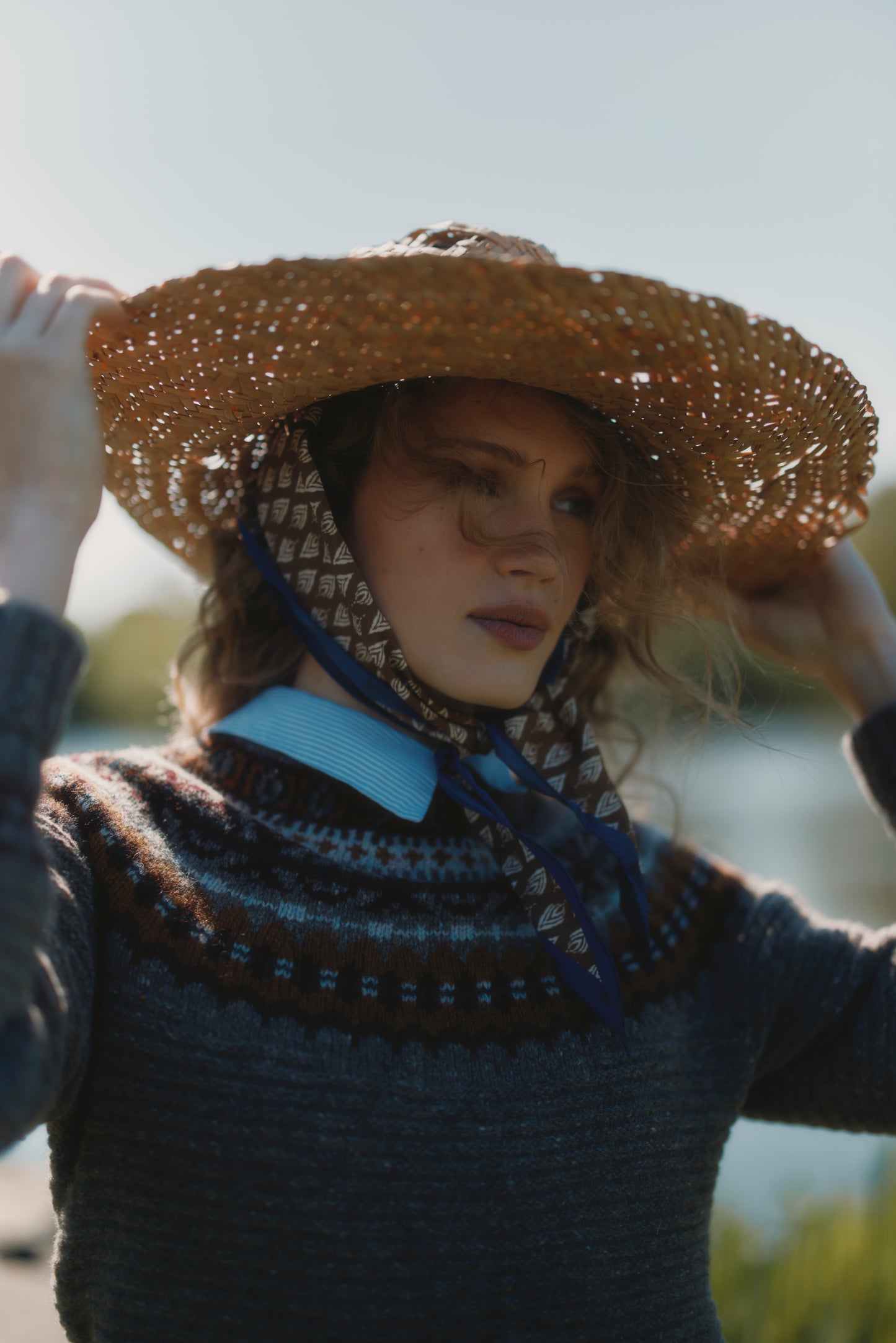 Model wearing a Bosie Knitwear Cottage Fair Isle Glenugie Nep Women's Sweater in colour Torridon Grey.