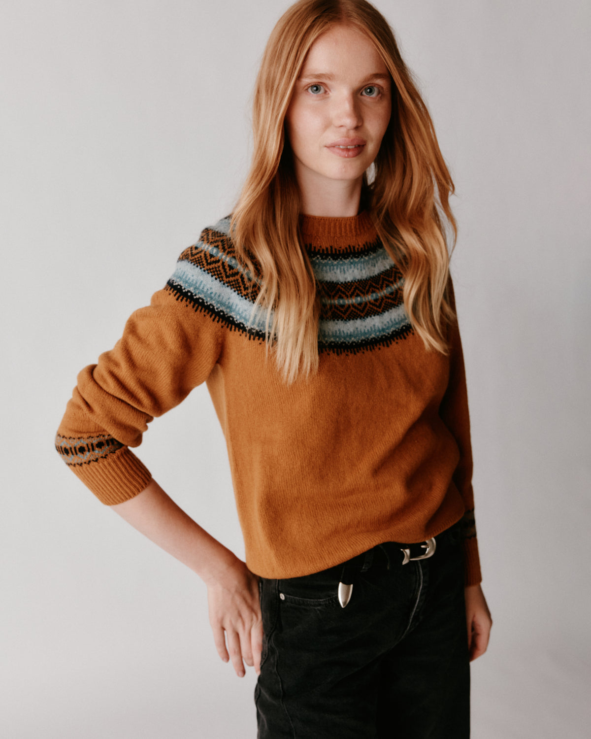 A model wearing a Bosie Fair Isle Geelong Women's Sweater in colour Chai