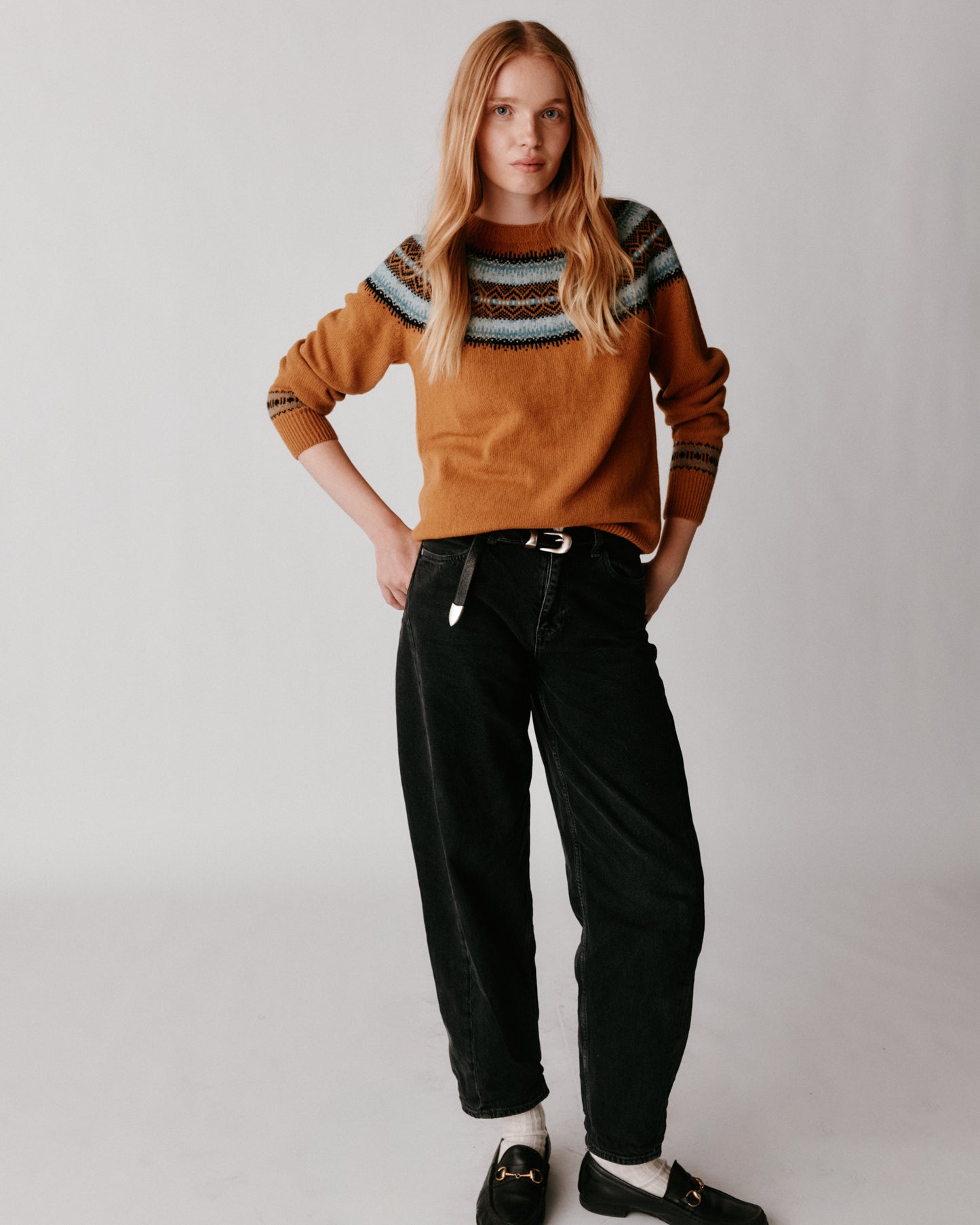 A model wearing a Bosie Fair Isle Geelong Women's Sweater in colour Chai