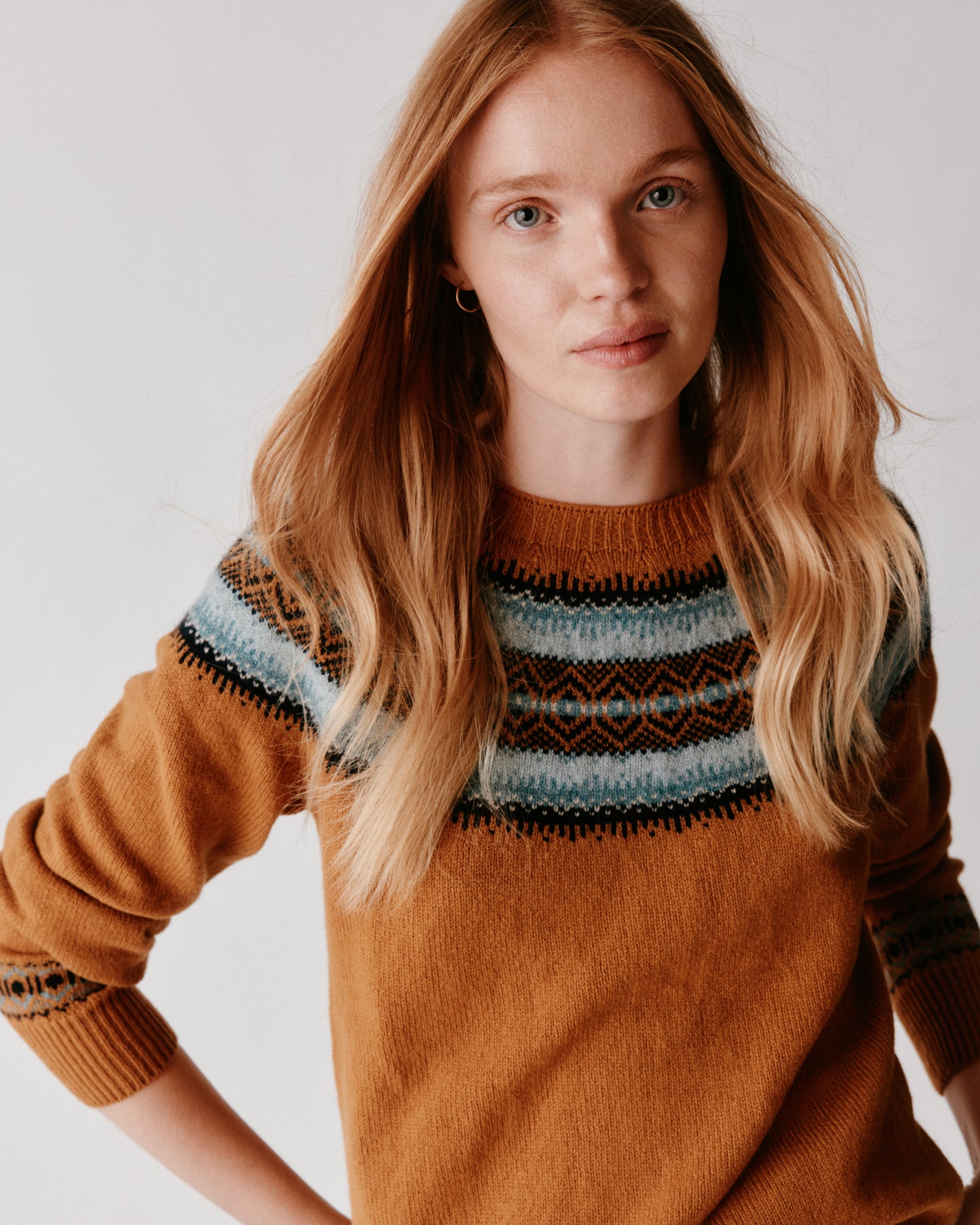 A model wearing a Bosie Fair Isle Geelong Women's Sweater in colour Chai