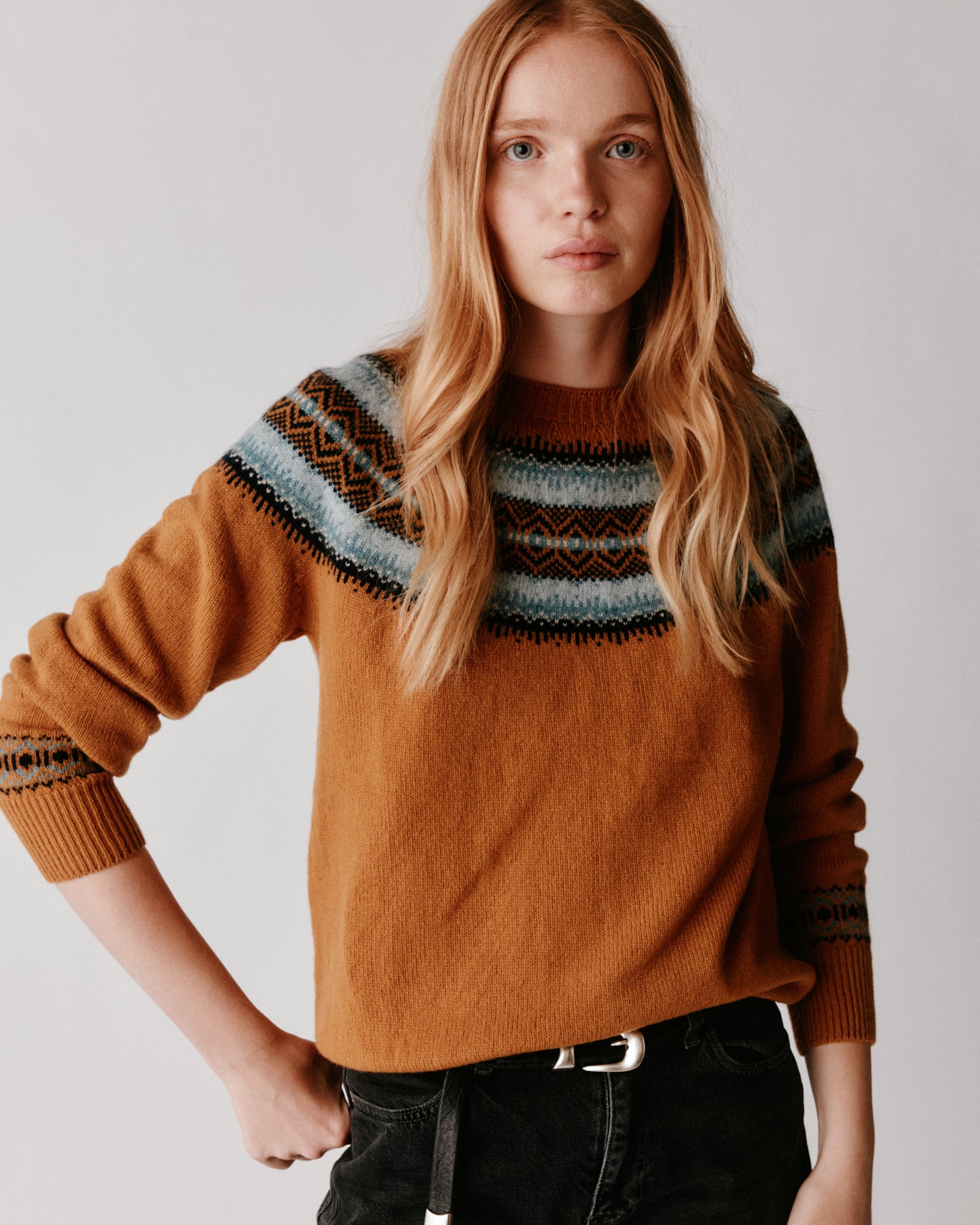 A model wearing a Bosie Fair Isle Geelong Women's Sweater in colour Chai