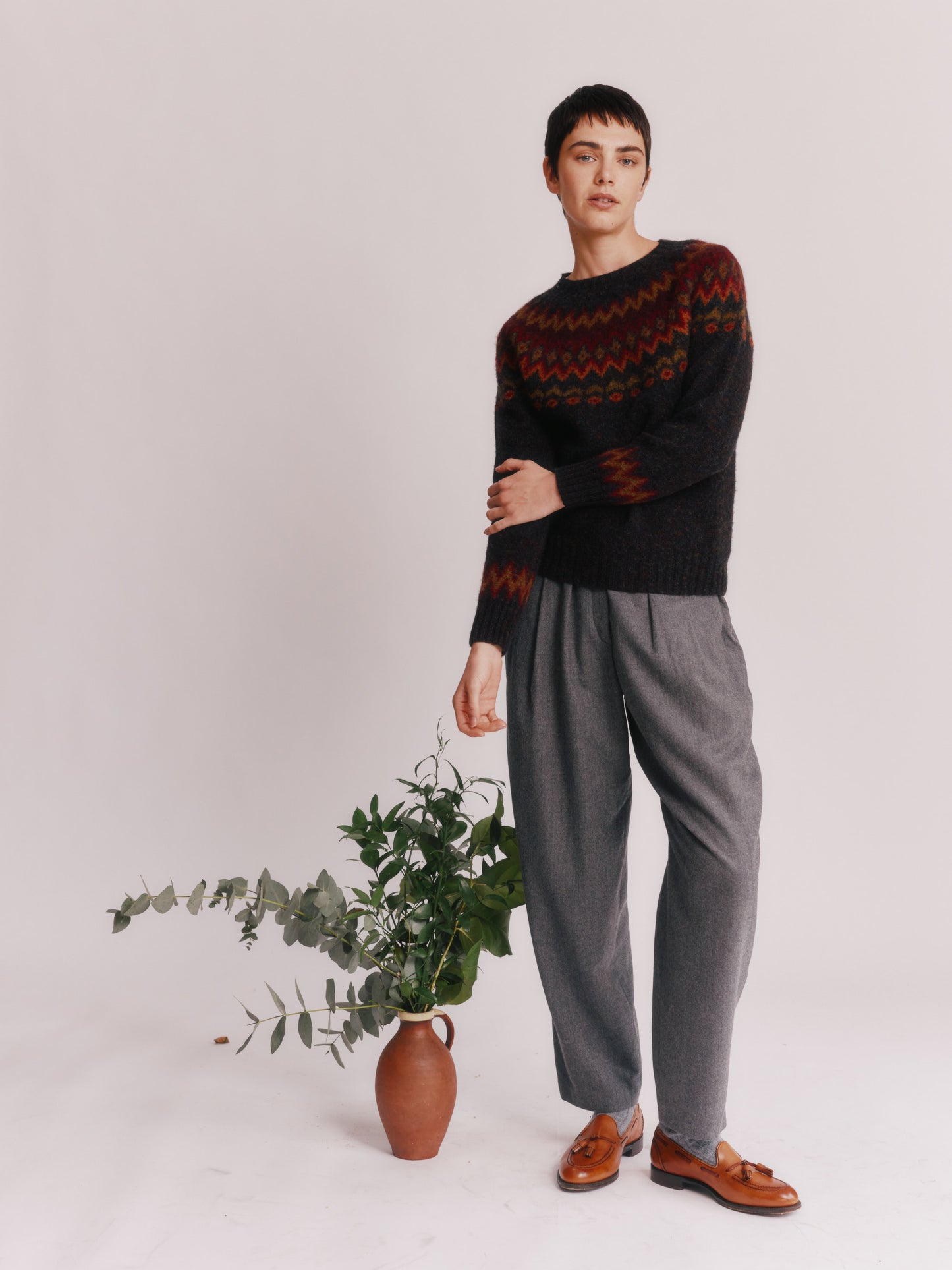 Model wearing a Bosie Knitwear Fjord Yoke Brushed Fair Isle Women's Lambswool Sweater in colour Midnight Black.