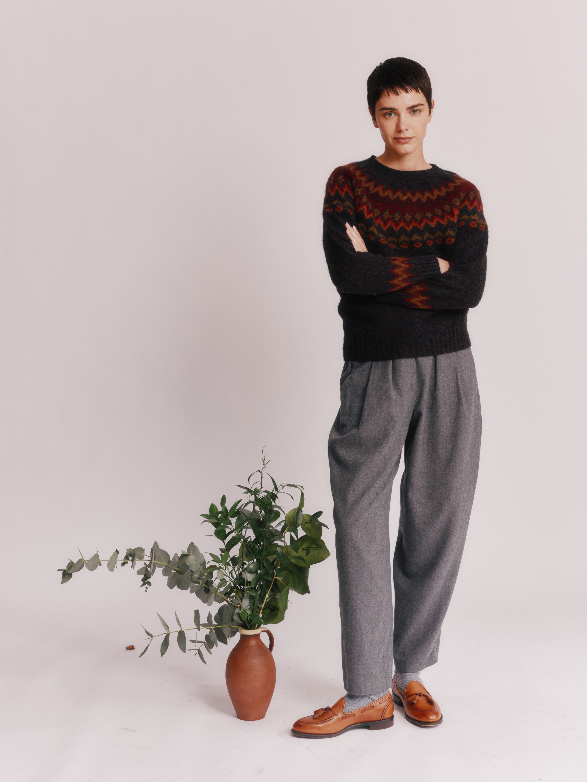 Model wearing a Bosie Knitwear Fjord Yoke Brushed Fair Isle Women's Lambswool Sweater in colour Midnight Black.
