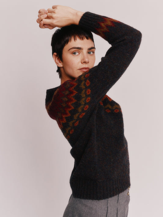 Model wearing a Bosie Knitwear Fjord Yoke Brushed Fair Isle Women's Lambswool Sweater in colour Midnight Black.