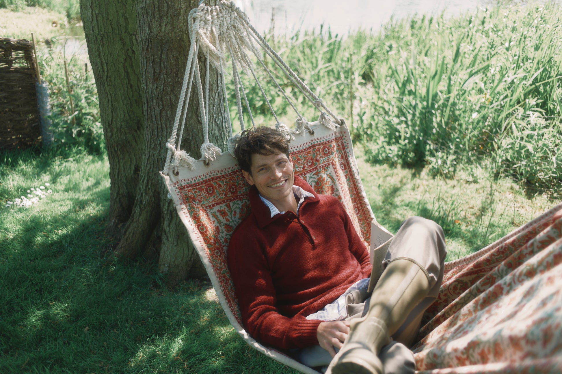 Model wearing a Bosie Knitwear Harley of Scotland Mens Shetland Eton Collar Sweater in colour Bordeaux Mix Burgundy.