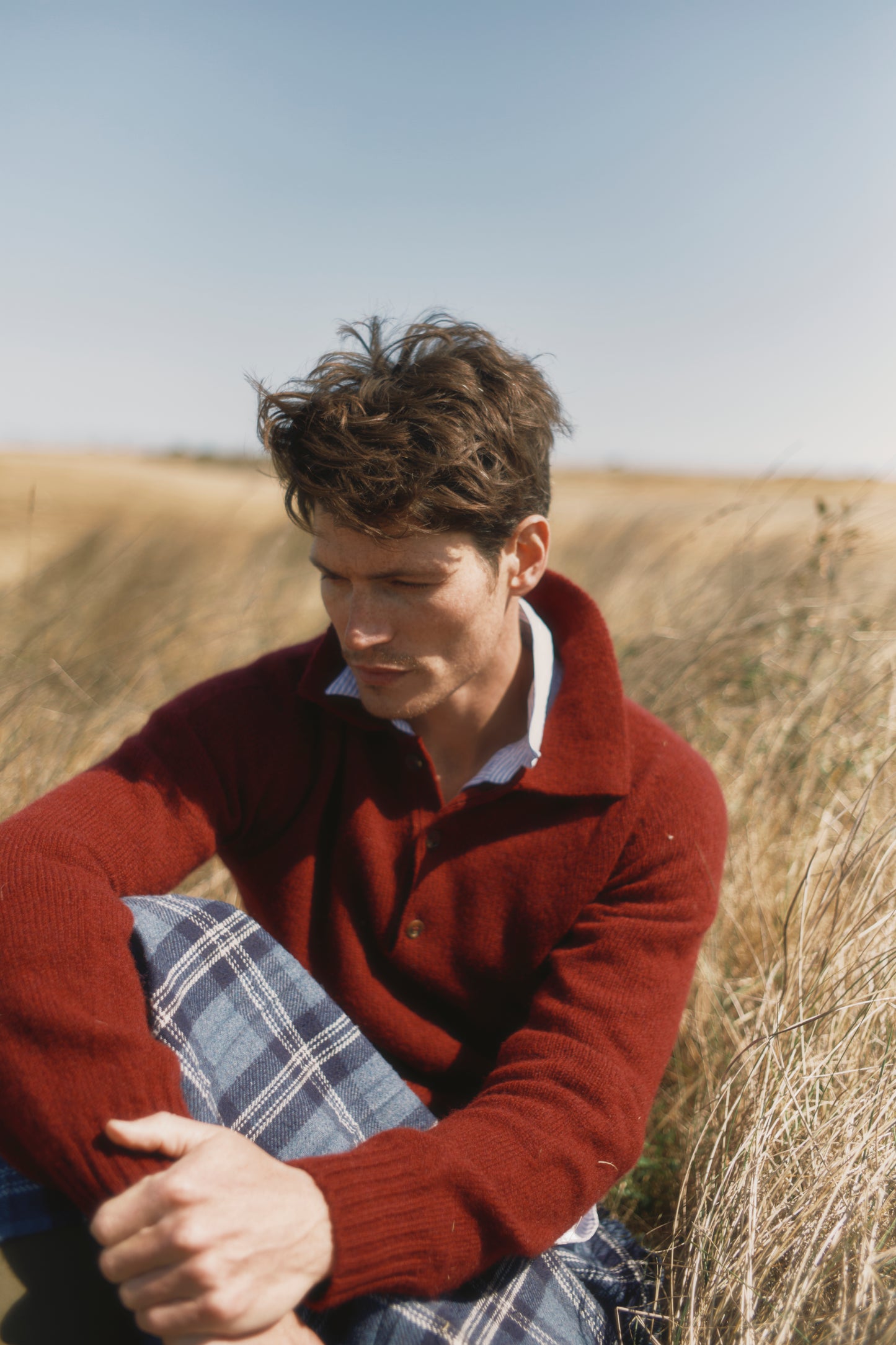 Model wearing a Bosie Knitwear Harley of Scotland Mens Shetland Eton Collar Sweater in colour Bordeaux Mix Burgundy.