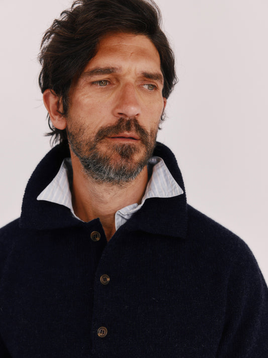 A model wearing a Harley of Scotland Mens Shetland Eton Collar Sweater in colour Navy.