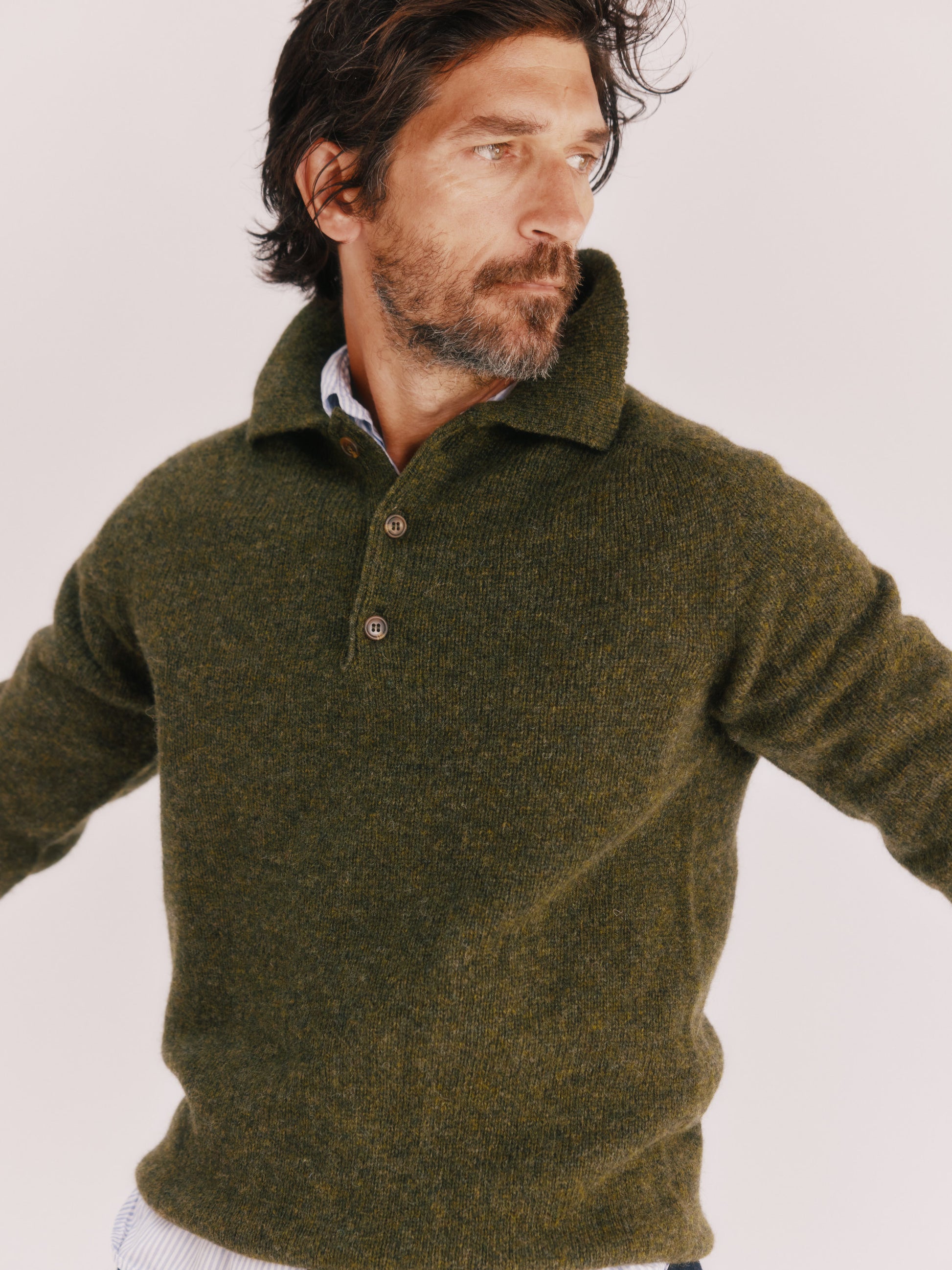 Model wearing a Bosie Knitwear Harley of Scotland Mens Shetland Eton Collar Sweater in colour Pineshadow Green.