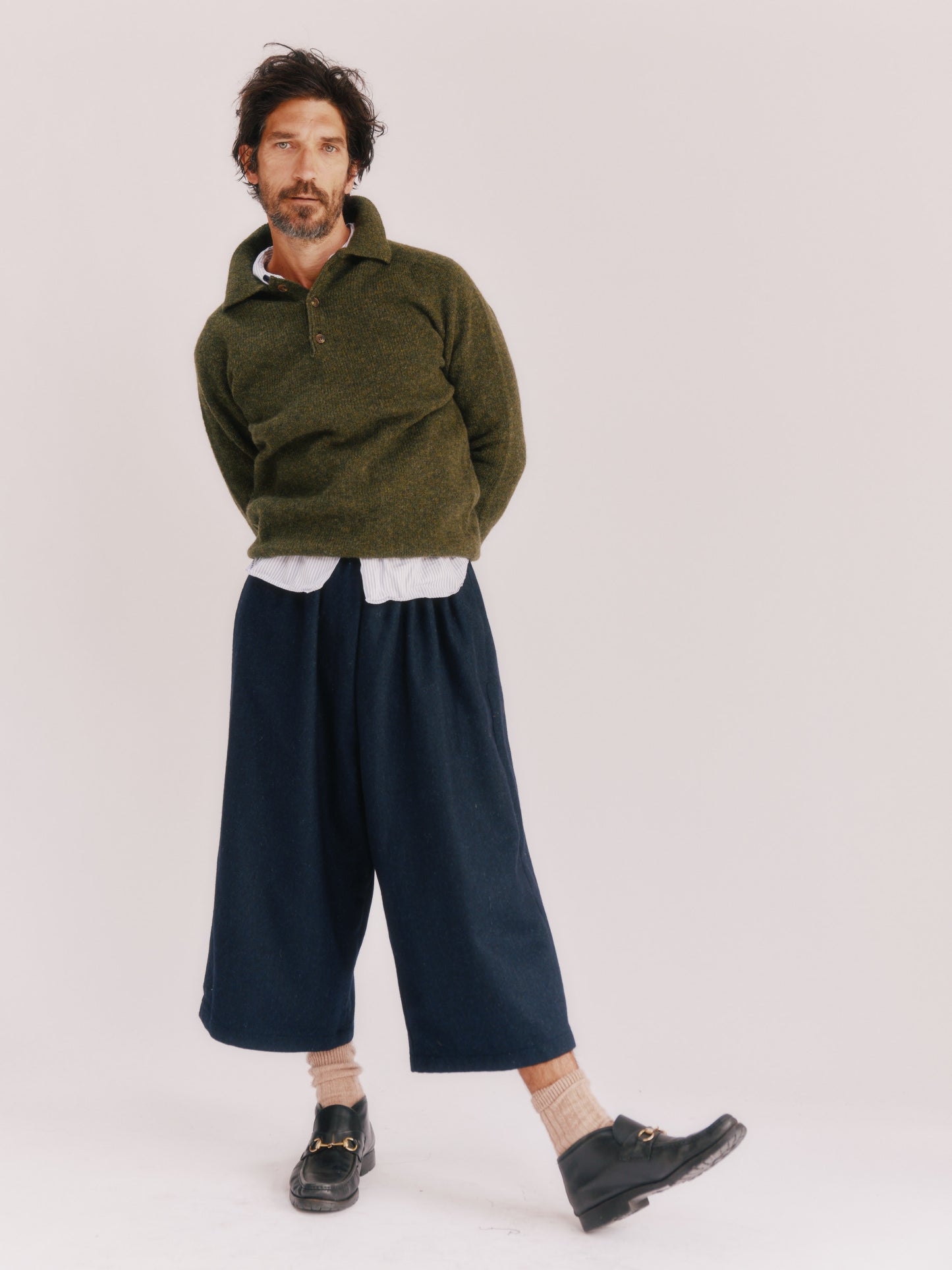 Model wearing a Bosie Knitwear Harley of Scotland Mens Shetland Eton Collar Sweater in colour Pineshadow Green.