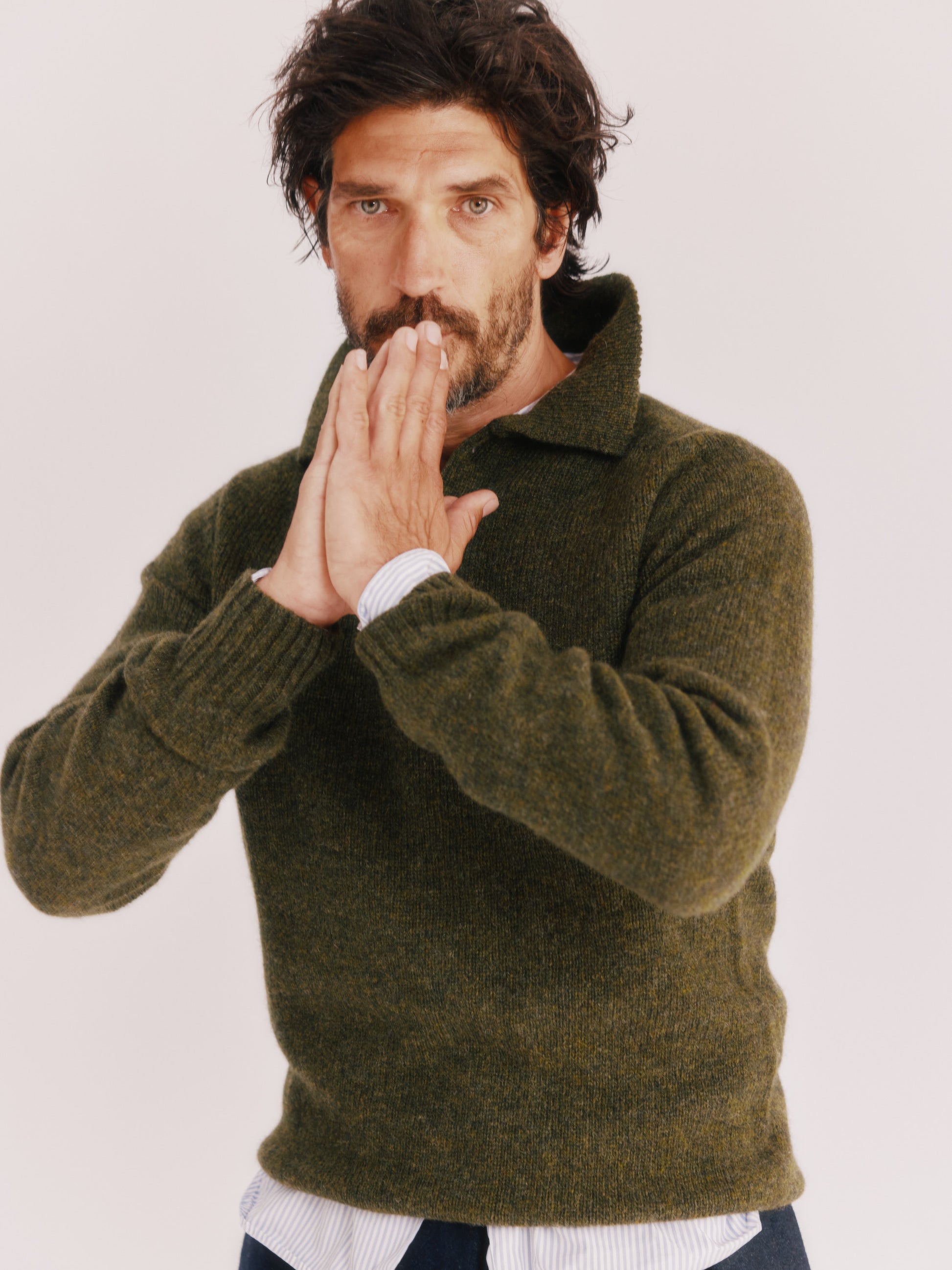 Model wearing a Bosie Knitwear Harley of Scotland Mens Shetland Eton Collar Sweater in colour Pineshadow Green.