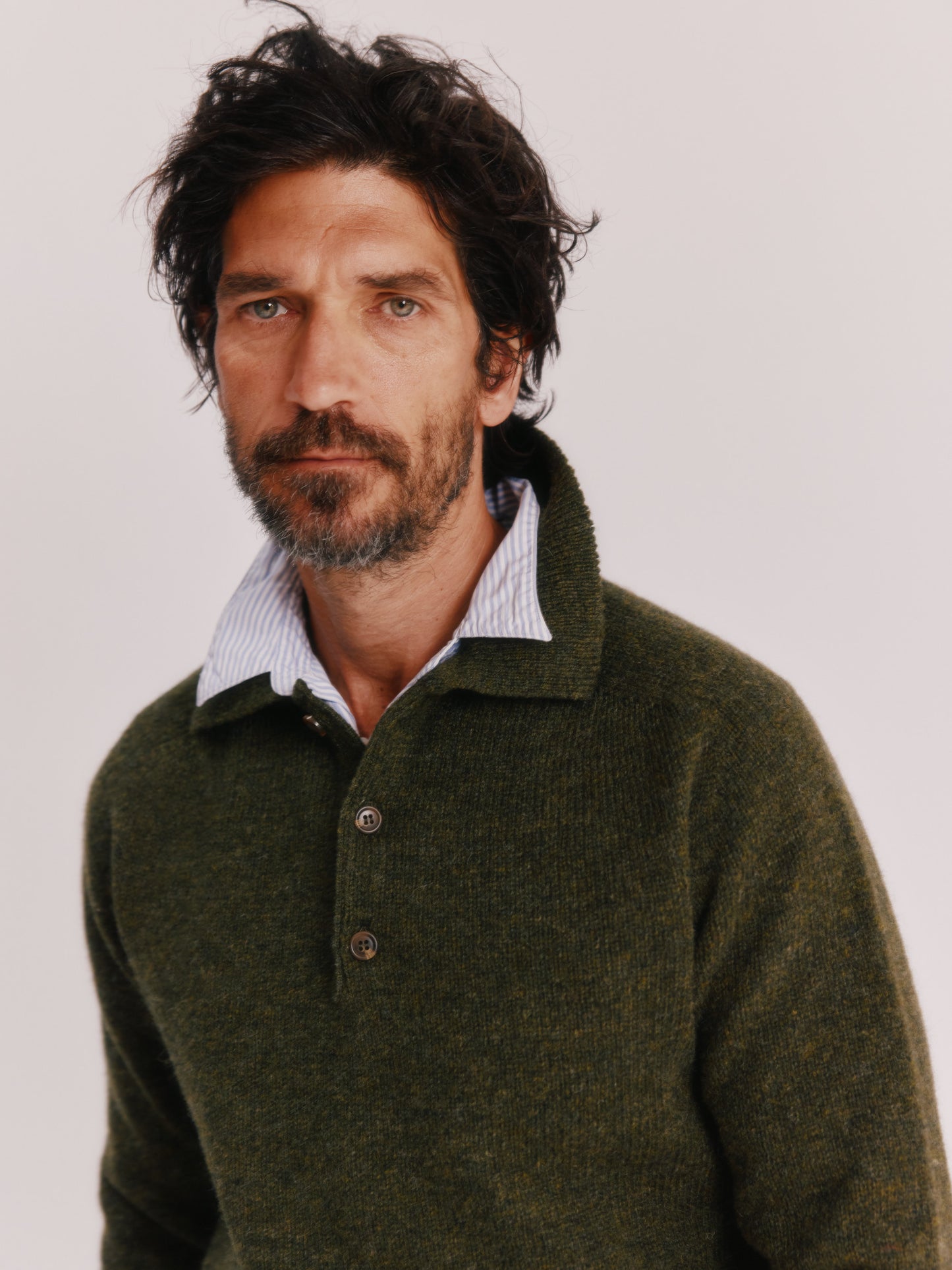 Model wearing a Bosie Knitwear Harley of Scotland Mens Shetland Eton Collar Sweater in colour Pineshadow Green.