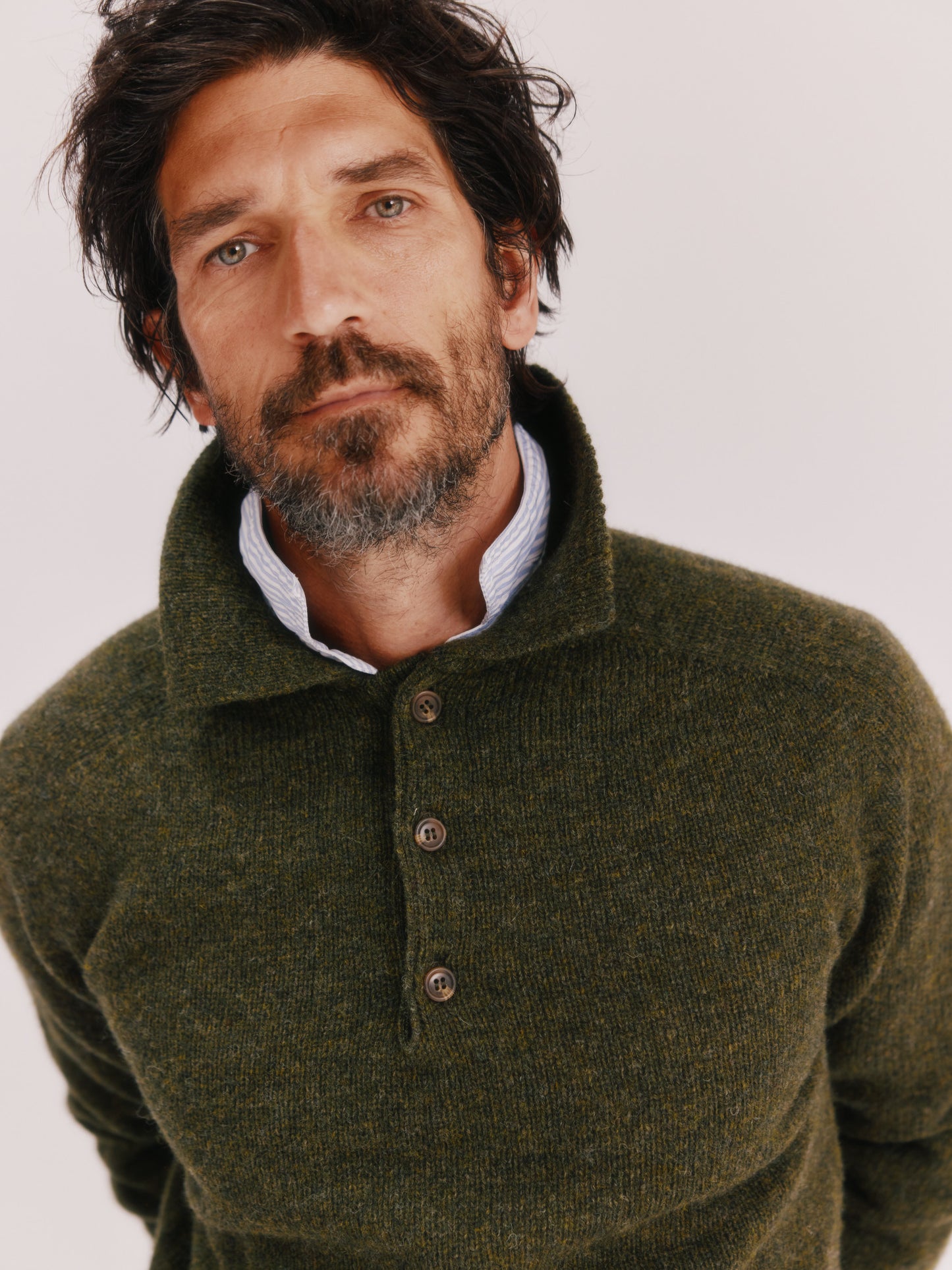 Model wearing a Bosie Knitwear Harley of Scotland Mens Shetland Eton Collar Sweater in colour Pineshadow Green.