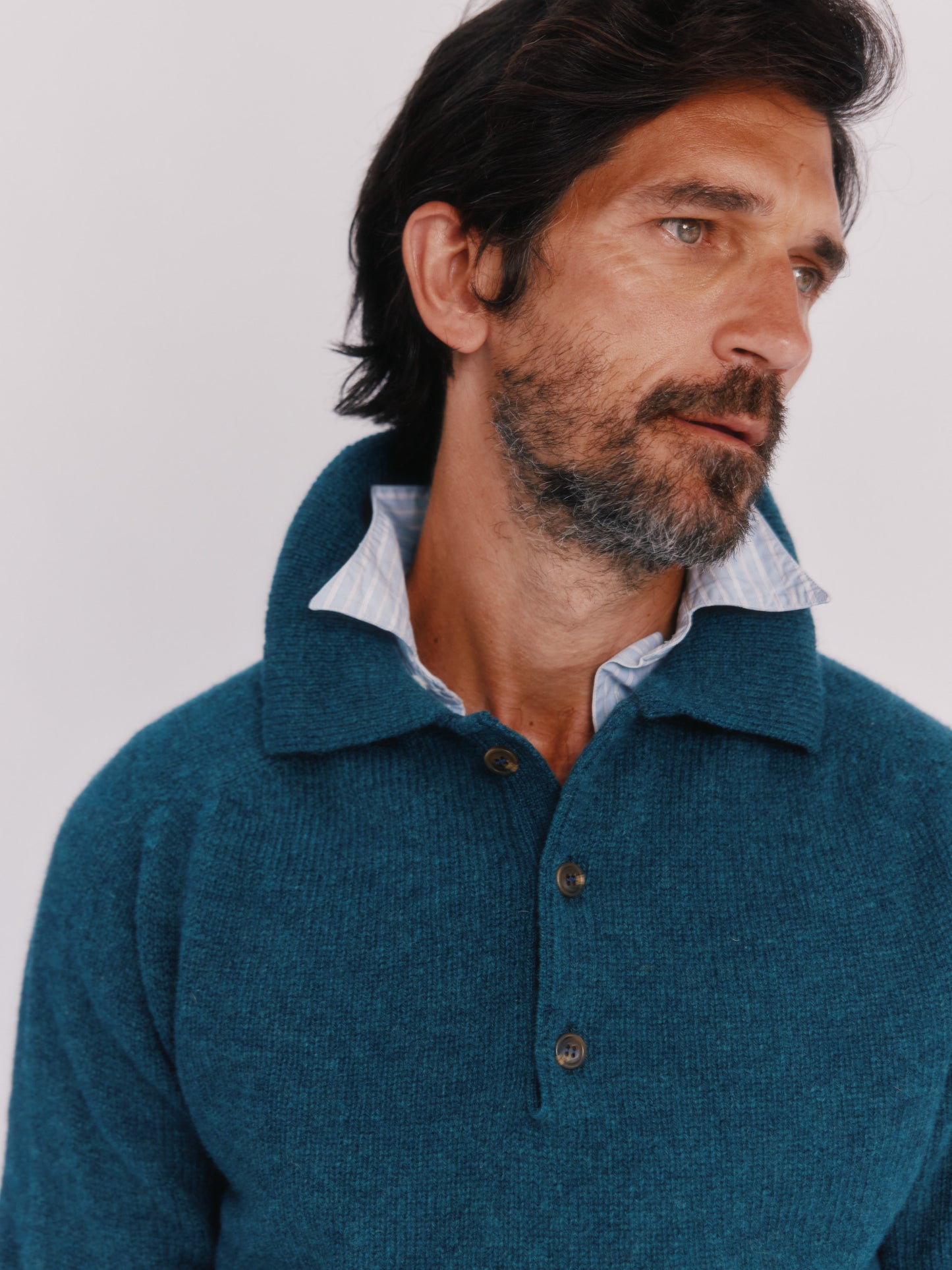 Model wearing a Bosie Knitwear Harley of Scotland Mens Shetland Eton Collar Sweater in colour Storm Dark Teal.