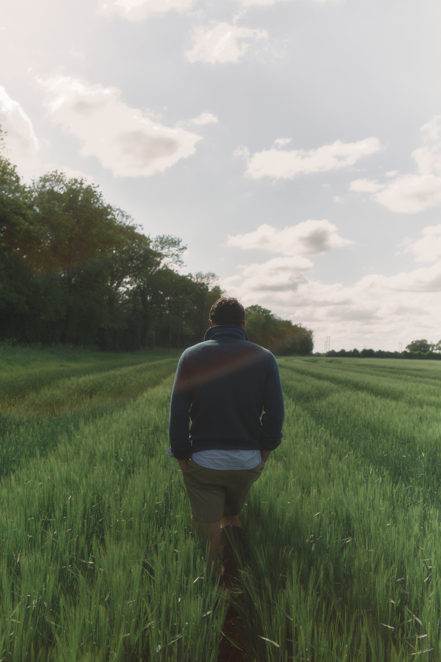 Model wearing a Bosie Knitwear Harley of Scotland Mens Shetland Eton Collar Sweater in colour Storm Dark Teal.