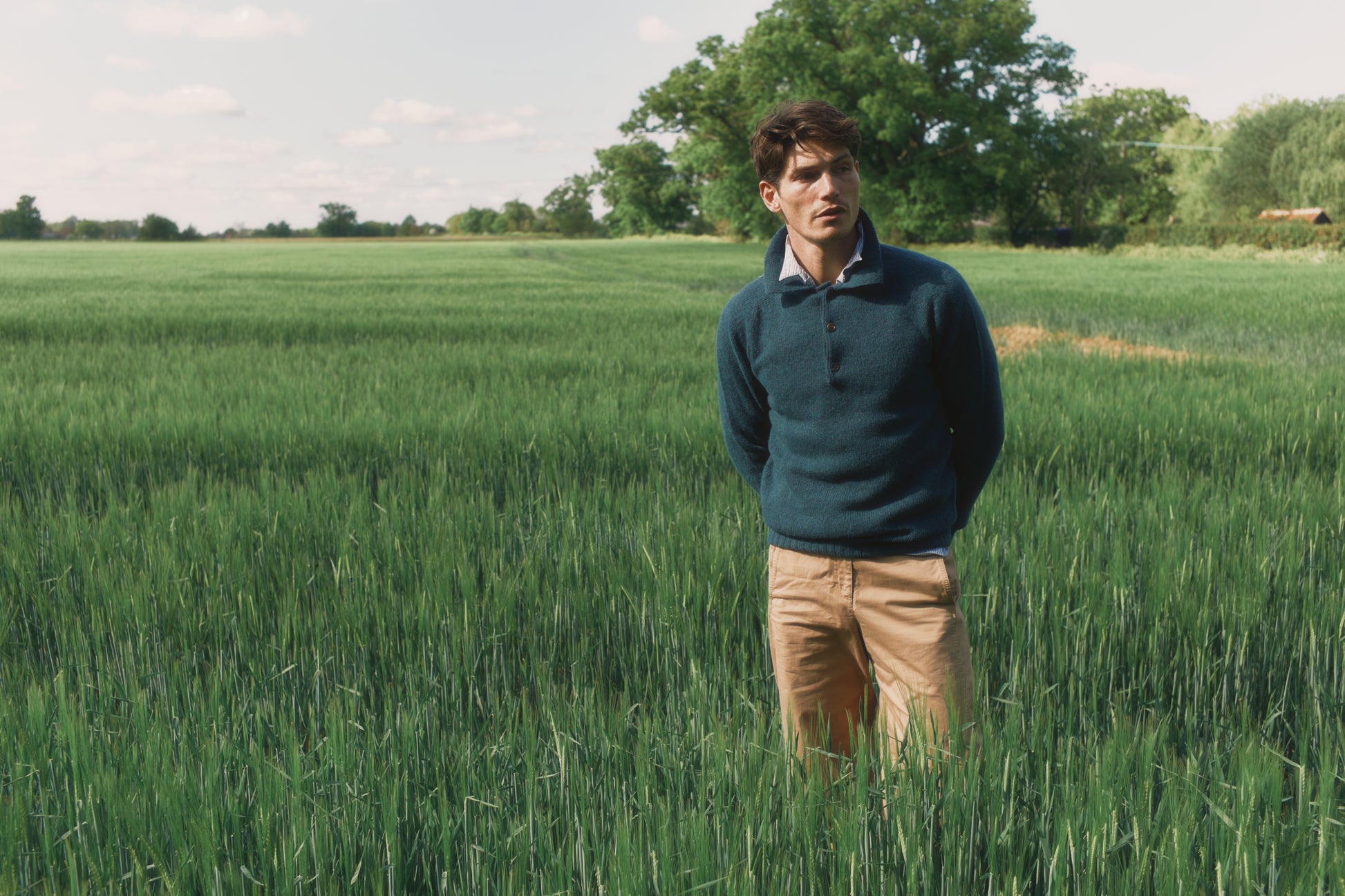 Model wearing a Bosie Knitwear Harley of Scotland Mens Shetland Eton Collar Sweater in colour Storm Dark Teal.