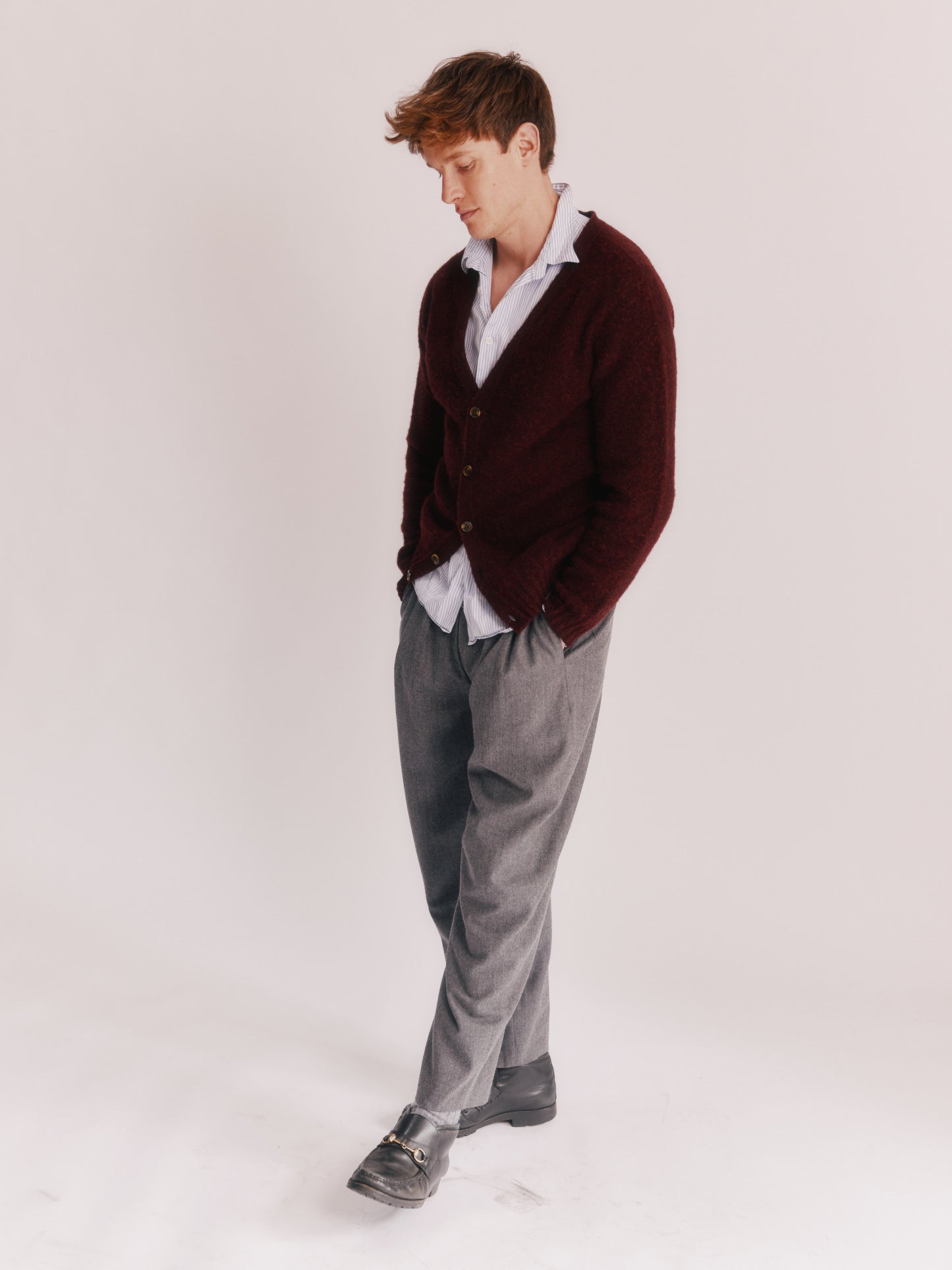 Model wearing a Bosie Knitwear Harley of Scotland Shaggy Shetland Men's V Cardigan in colour Dark Cranberry.