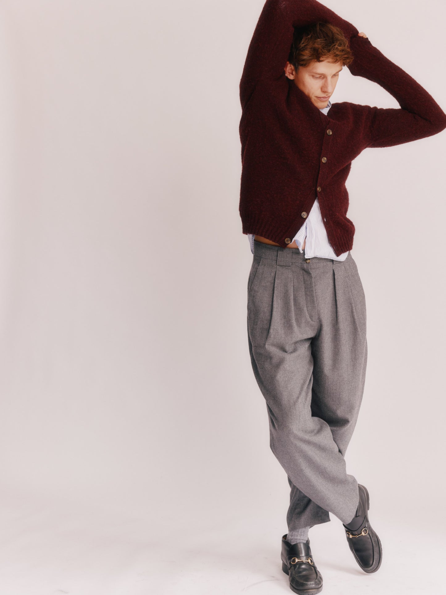 Model wearing a Bosie Knitwear Harley of Scotland Shaggy Shetland Men's V Cardigan in colour Dark Cranberry.