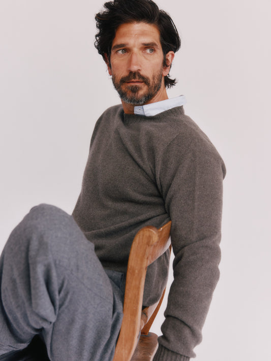 A model wearing a Bosie Harley Todd and Duncan Cashmere Sweater in colour Ibex / Drab Bronze.