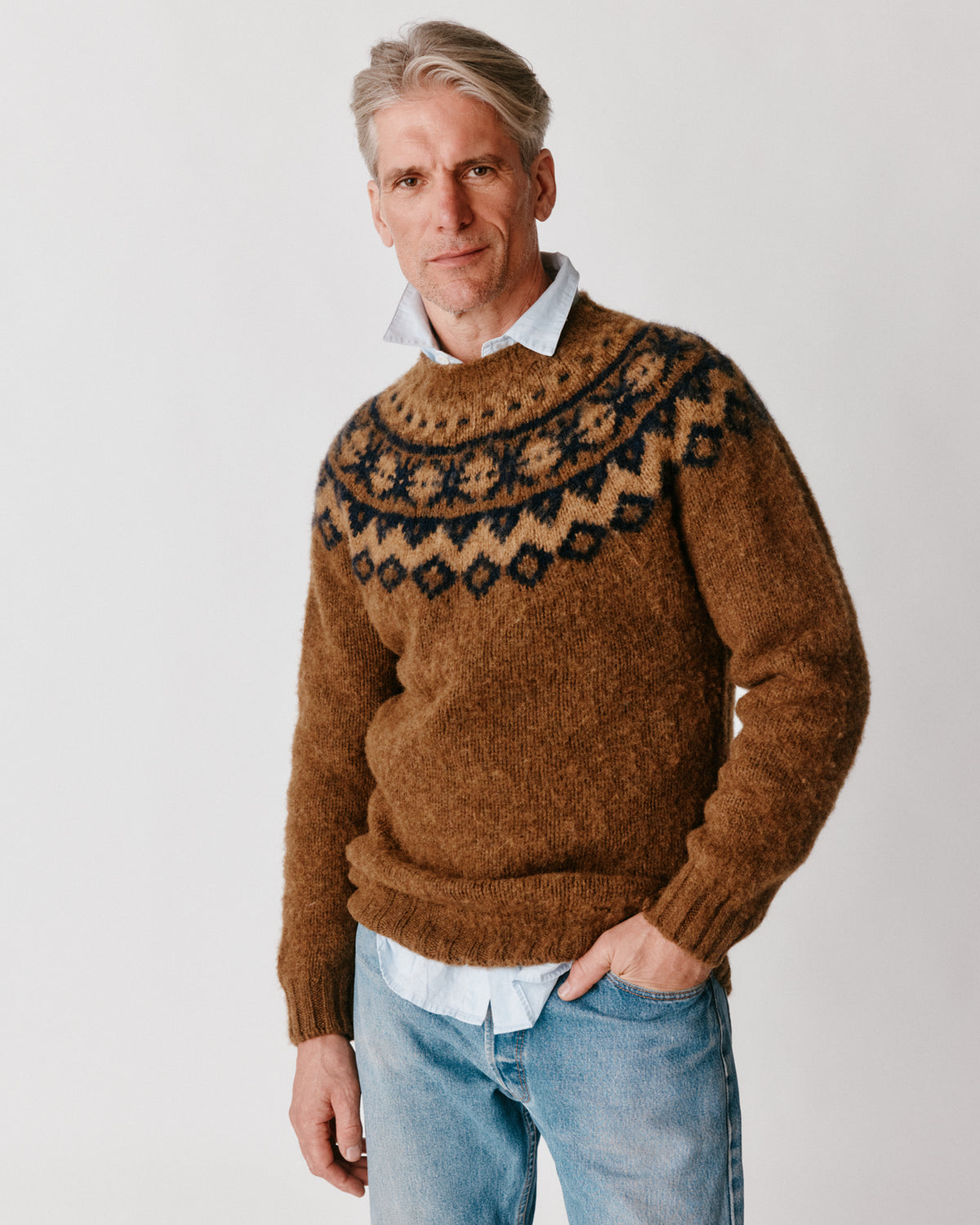 A model wearing a Bosie Highland Brushed Fairisle Yoke Lambswool Sweater in colour Moorland / Dark Olive.
