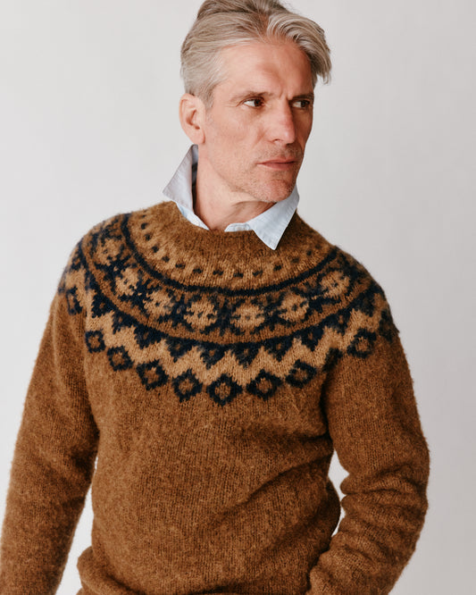 A model wearing a Bosie Highland Brushed Fairisle Yoke Lambswool Sweater in colour Moorland / Dark Olive.