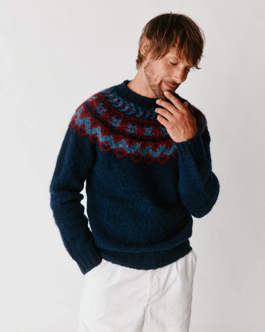 A model wearing a Bosie Highland Brushed Fairisle Yoke Lambswool Sweater in colour Navy.