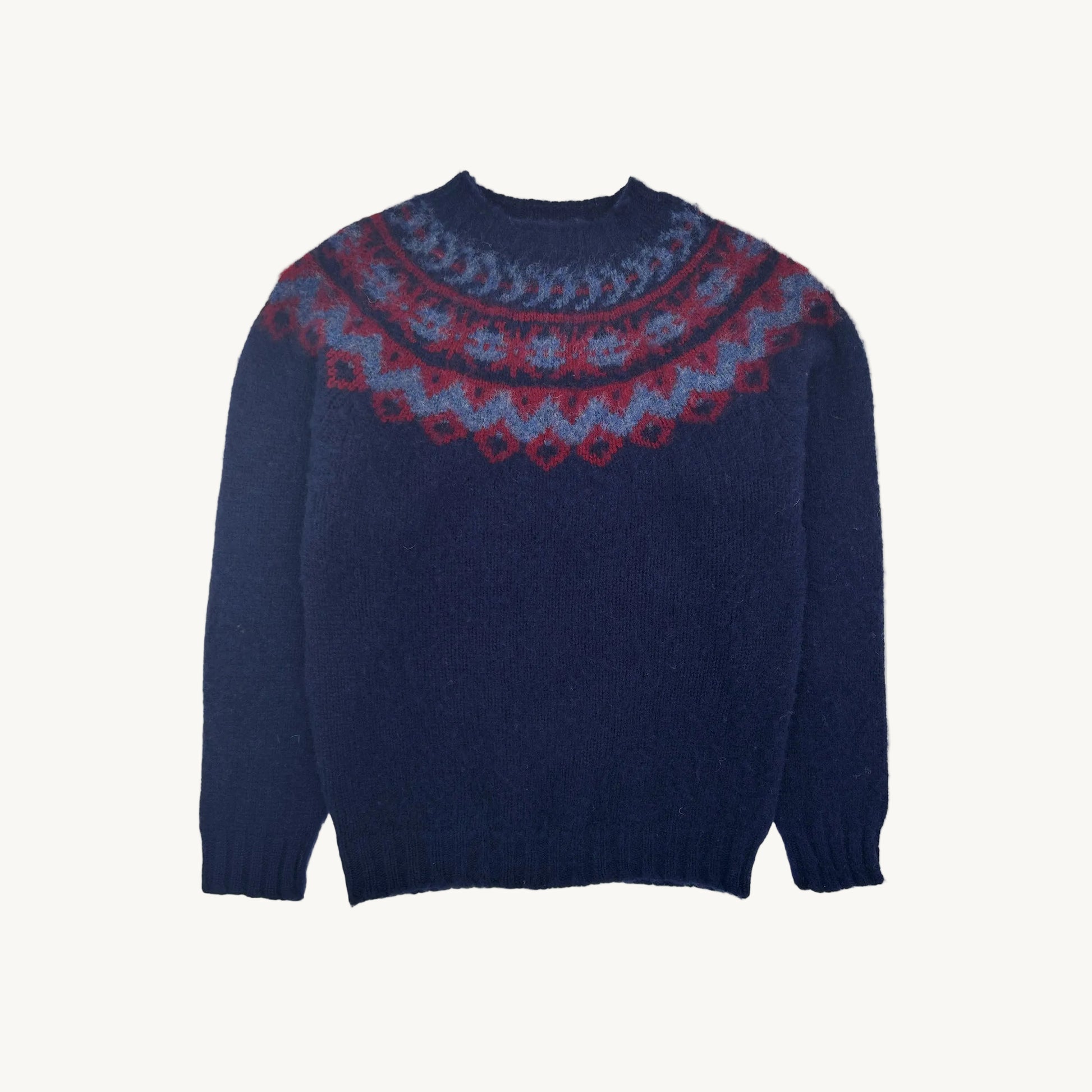 A flatbed photograph of a Bosie Highland Brushed Fairisle Yoke Lambswool Sweater in colour Navy.