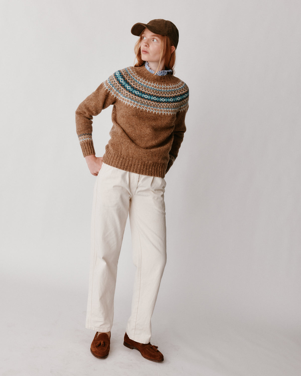 A model wearing a Bosie Islander Yoke Fair Isle Glenugie Nep Women's Sweater in colour Knoydart.