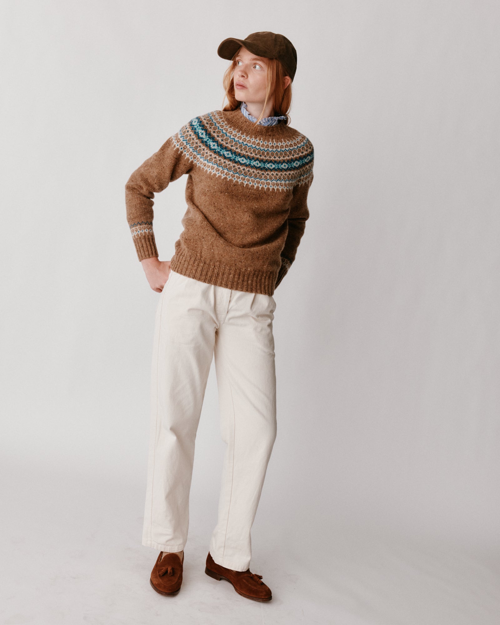 A model wearing a Bosie Islander Yoke Fair Isle Glenugie Nep Women's Sweater in colour Knoydart.