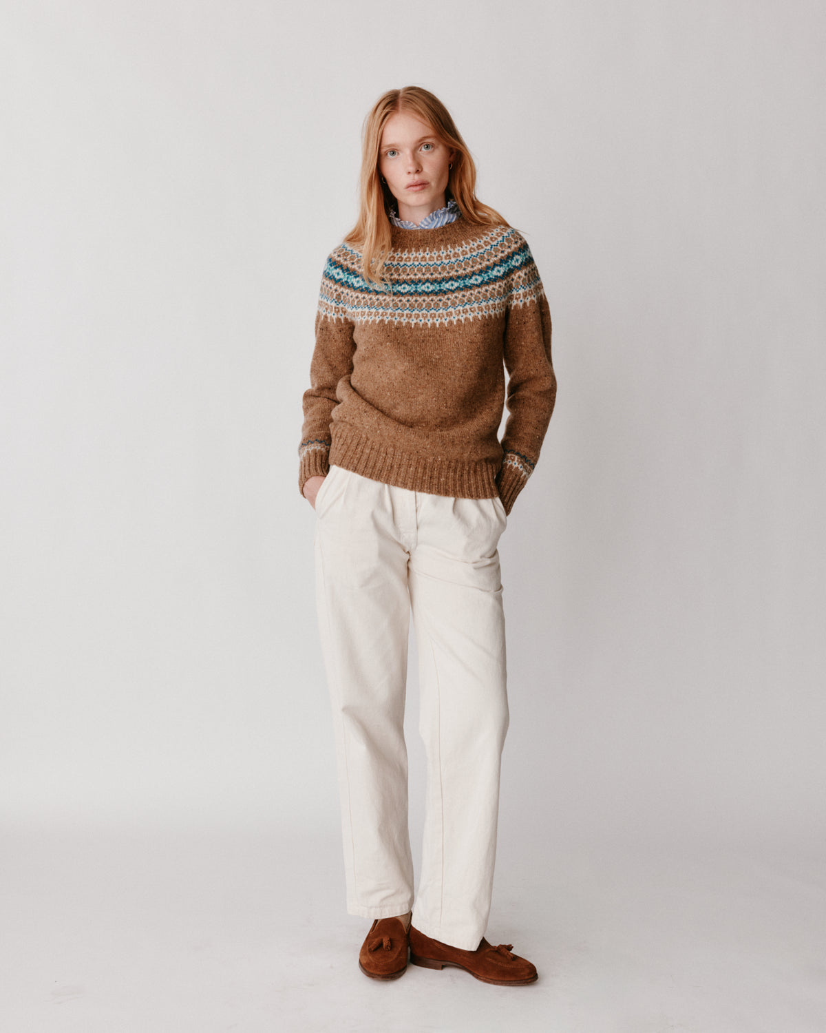 A model wearing a Bosie Islander Yoke Fair Isle Glenugie Nep Women's Sweater in colour Knoydart.