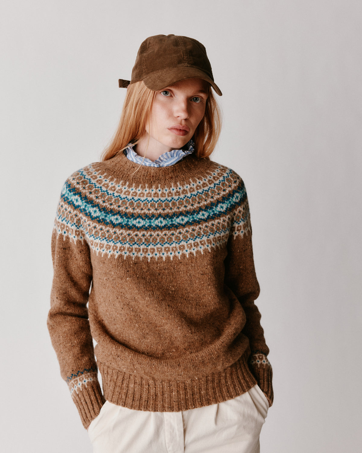 A model wearing a Bosie Islander Yoke Fair Isle Glenugie Nep Women's Sweater in colour Knoydart.