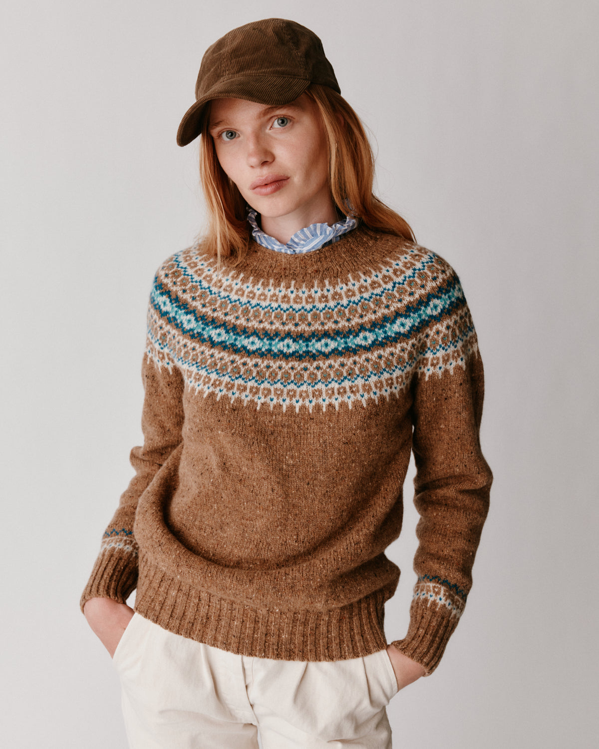 A model wearing a Bosie Islander Yoke Fair Isle Glenugie Nep Women's Sweater in colour Knoydart.