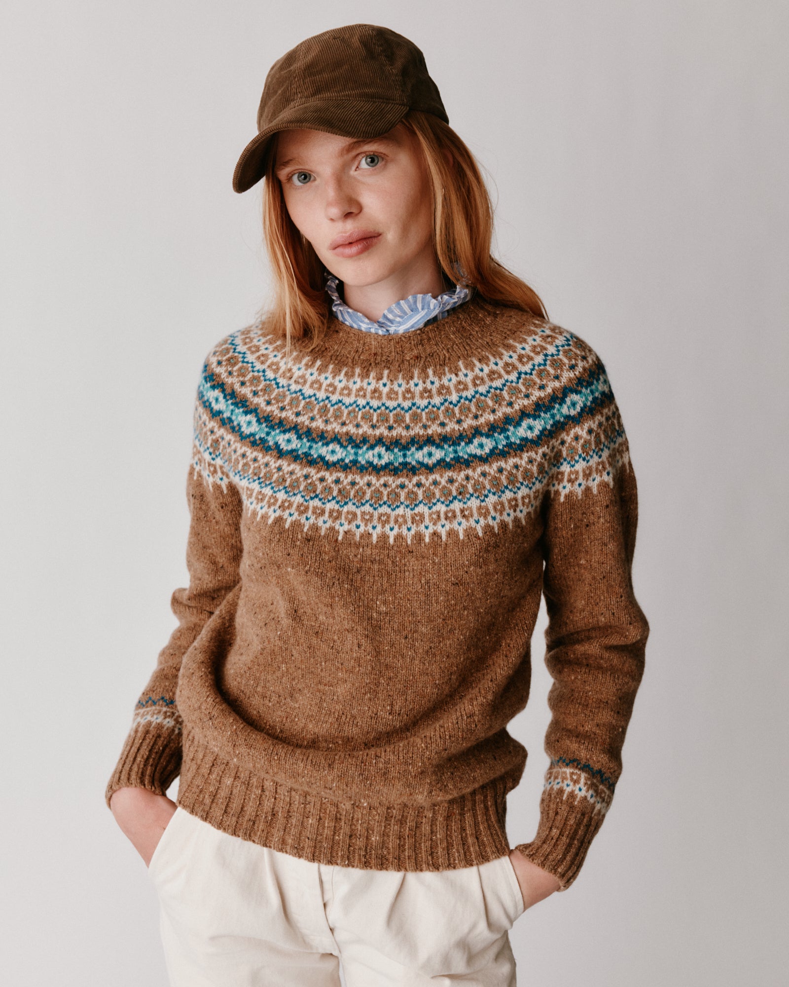 A model wearing a Bosie Islander Yoke Fair Isle Glenugie Nep Women's Sweater in colour Knoydart.
